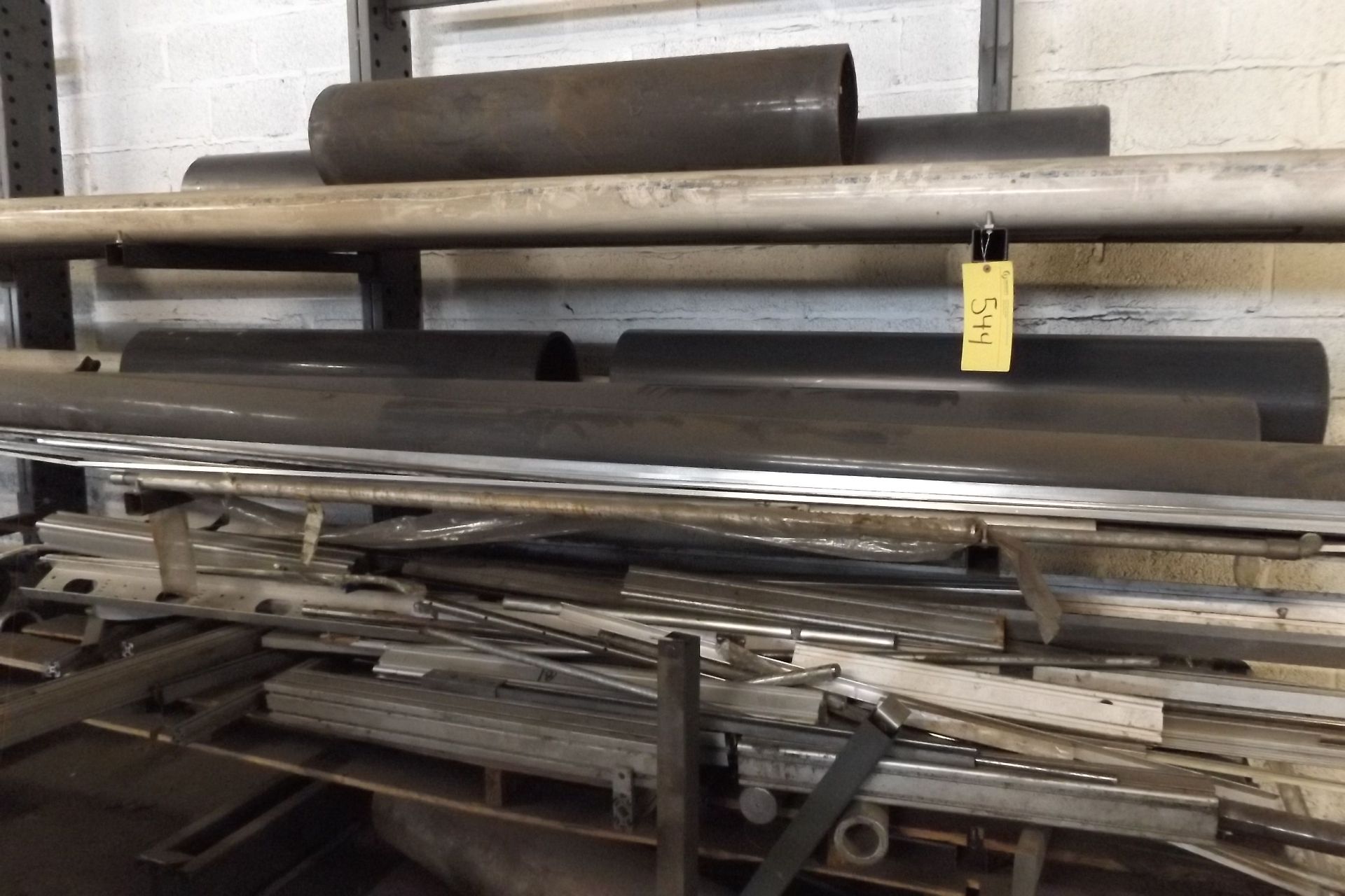 LOT OF 2 RACKS, CW/ CONTENTS,  ASSORTED PVC, EXTRUDED ALUMINUM, REBAR  (MAINT SHOP) (LOCATED IN