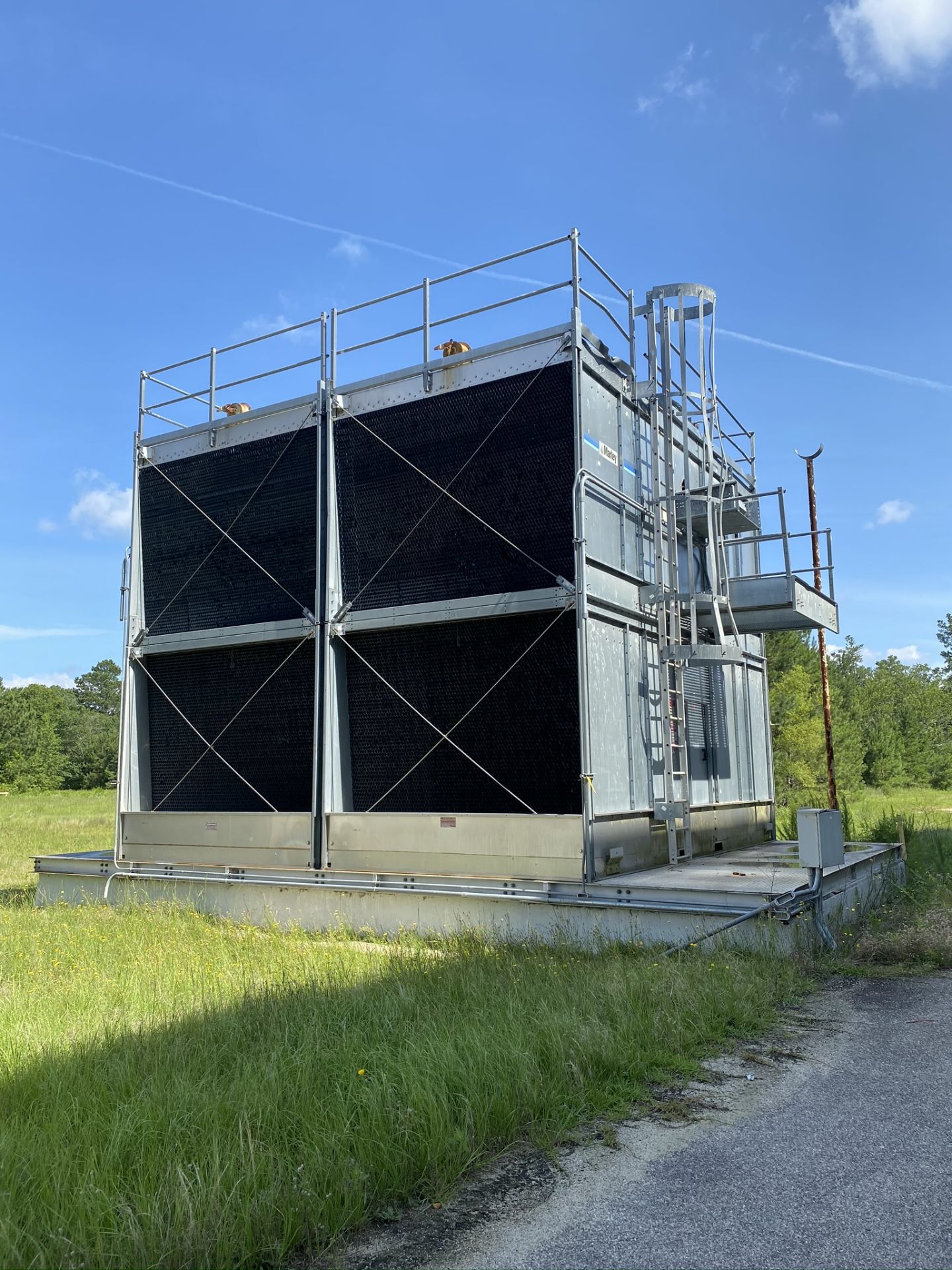 Marley Water Cooling Tower. MODEL NC8310F-2 BM, S/N NC8310F2BM W/ 40HP MOTOR behind Scotland