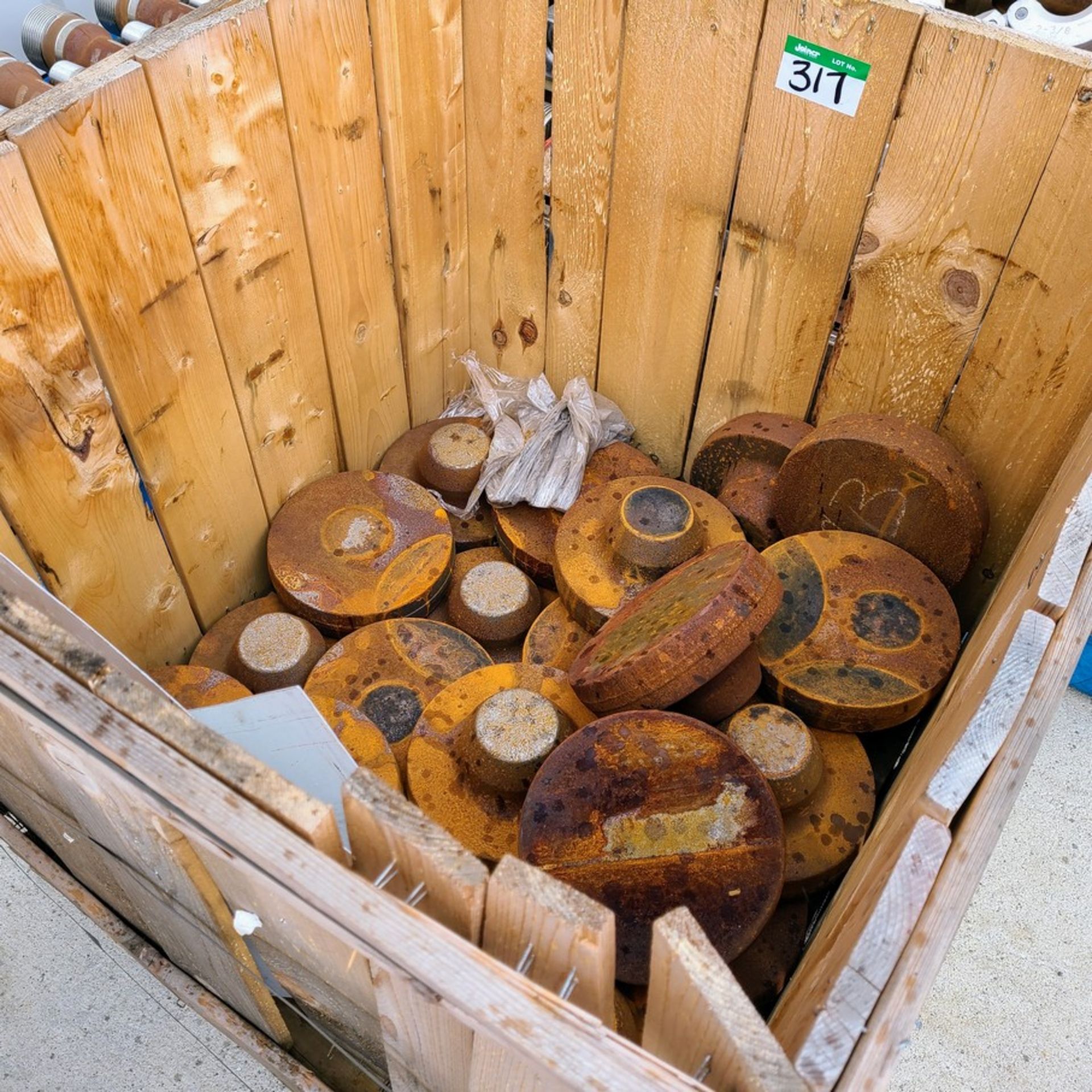 BOX OF ROUND STEEL CASTINGS