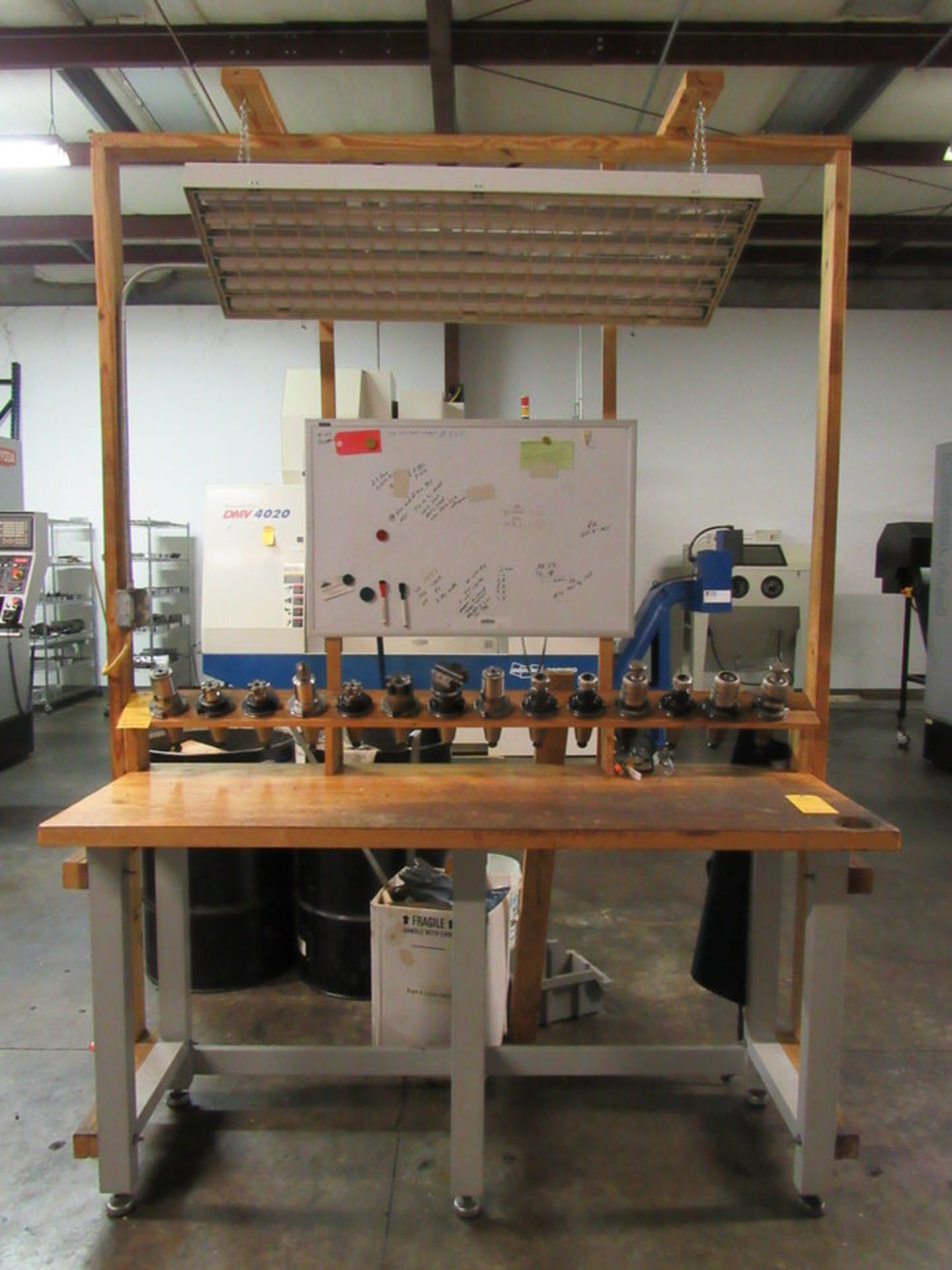 Machinist's Work Station, 25" x 72" x 38-1/2" high wooden table, 14 tool holding stations, white