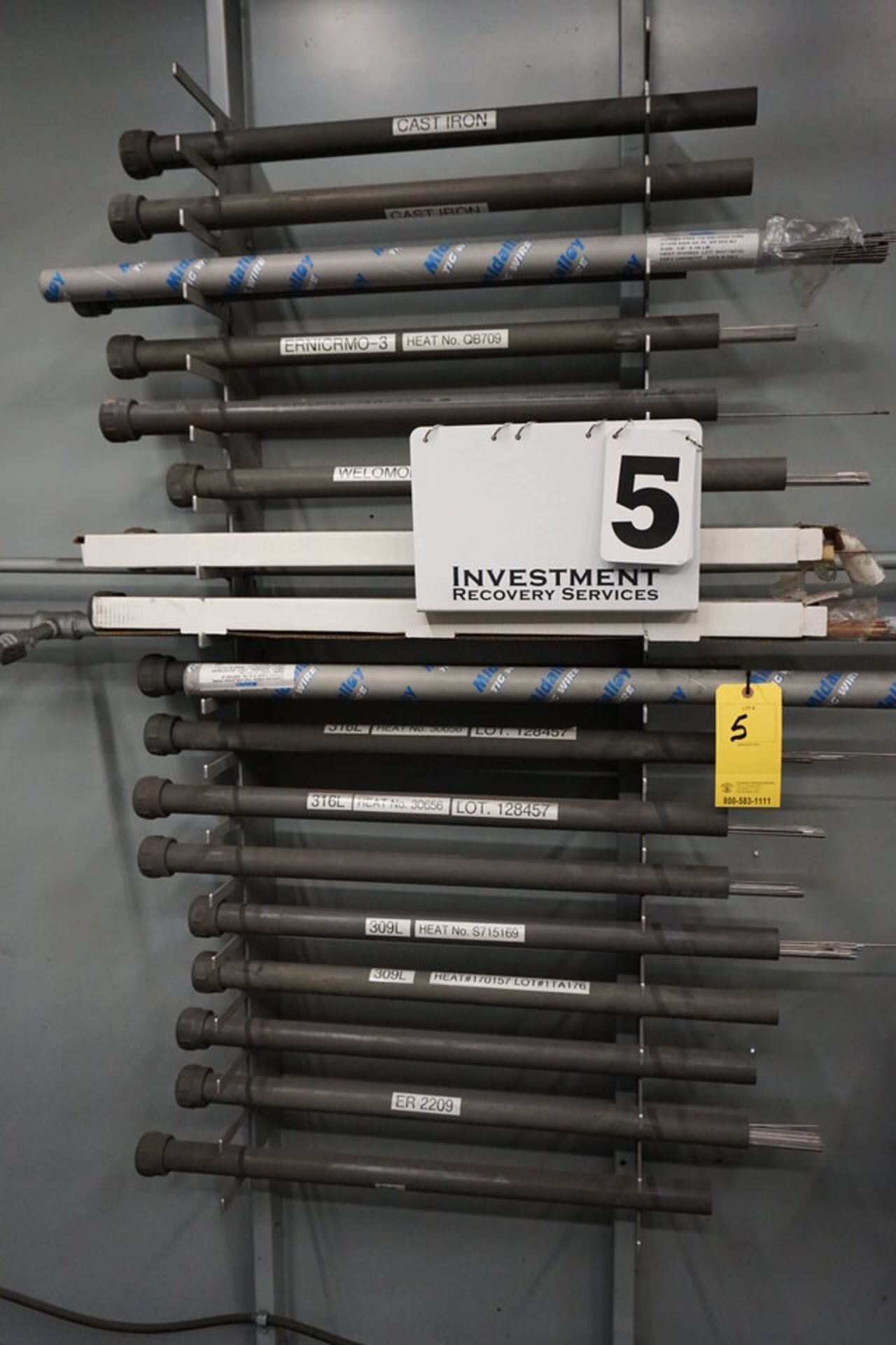 ASSORT WELDING RODS IN WALL RACK