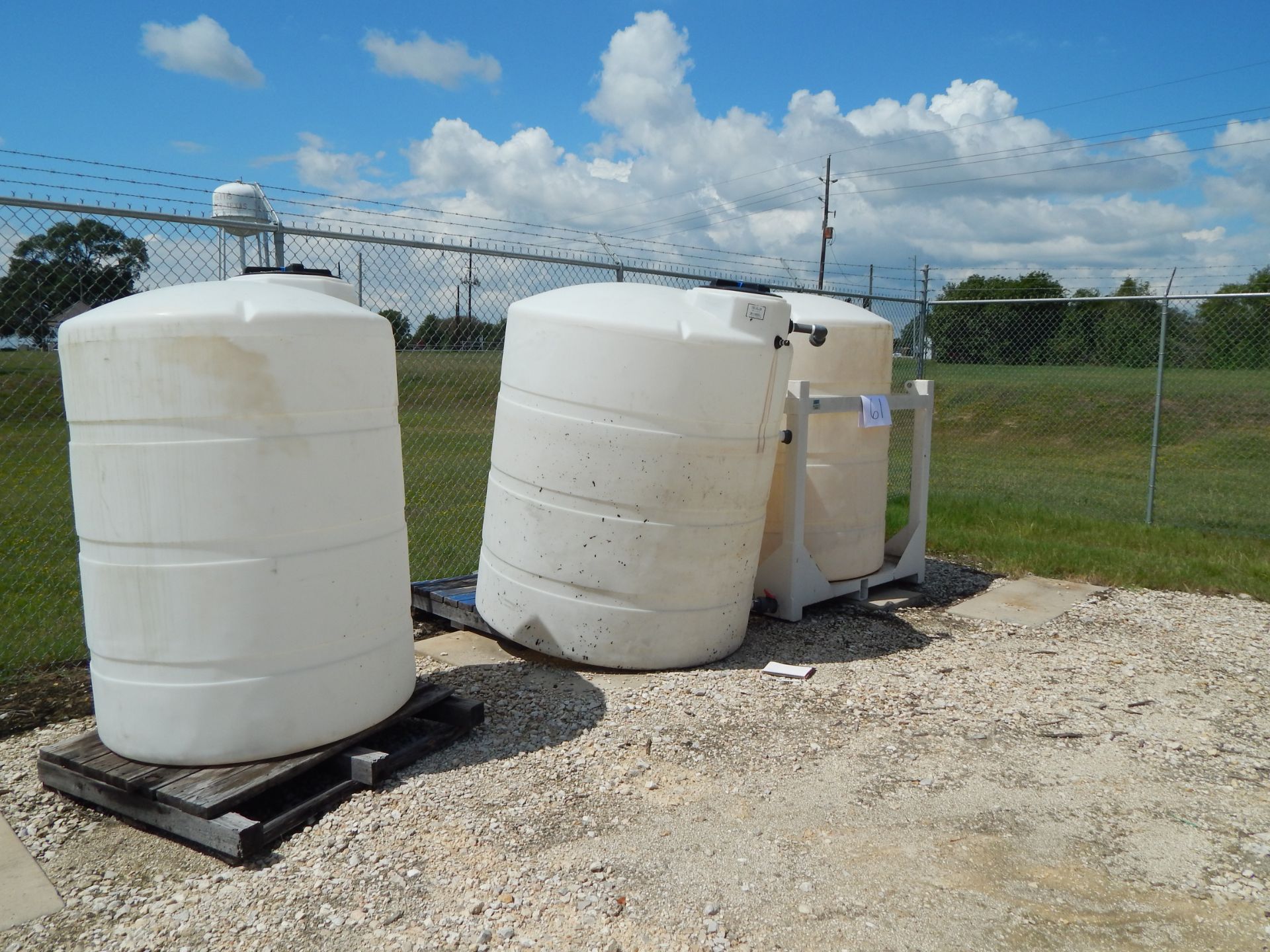 Three Poly Water tanks: (2) 1000 gallon tank, (1) 500 Gallon & (1) Metal stand