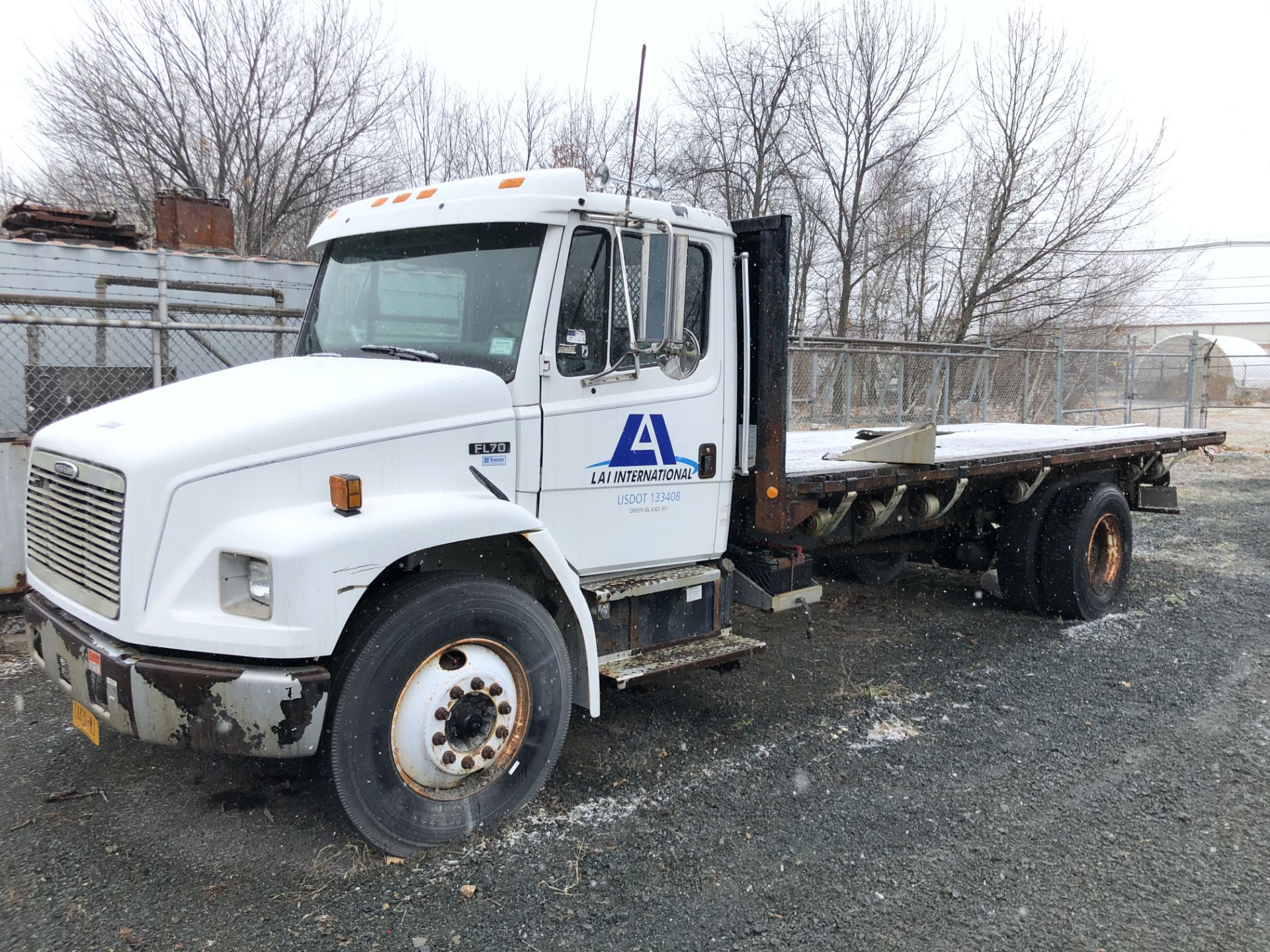 2001 INTERNATIONAL FL70 SINGLE AXLE FLATBED TRUCK