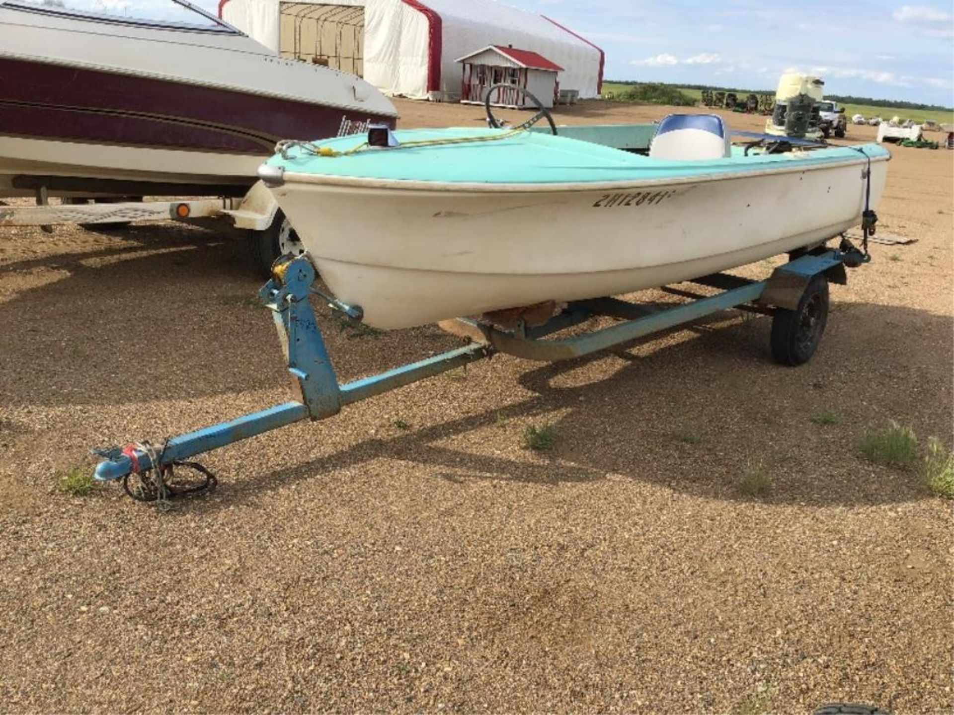 13.5ft Fibreglass Boat c/w 65hp 350 Merc Kicker & Trailer. Kicker is in good running order. No VIN