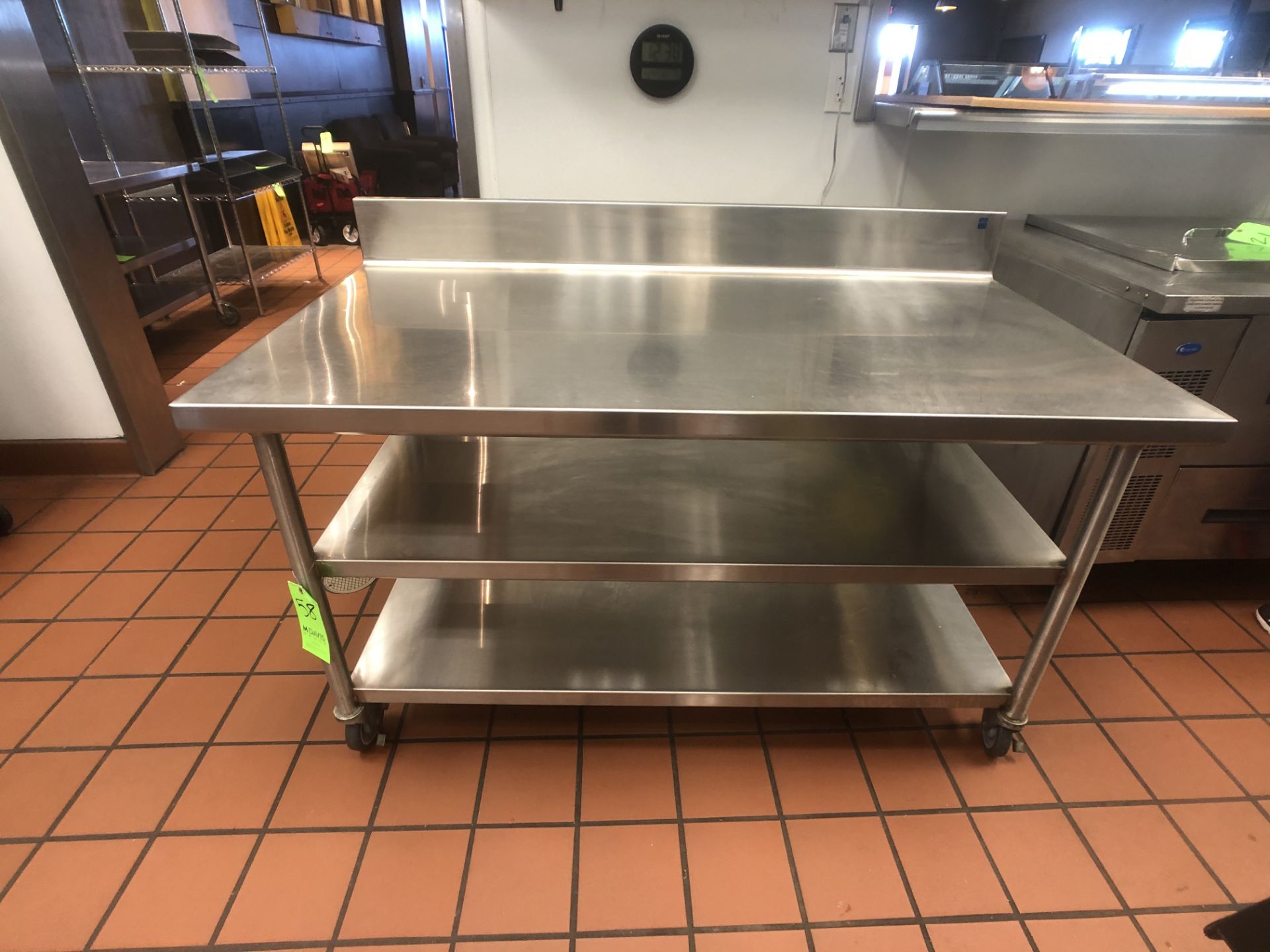 S/S Table with Racks and S/S Backsplash, Approx. 60" L x 32" W, Mounted on Casters