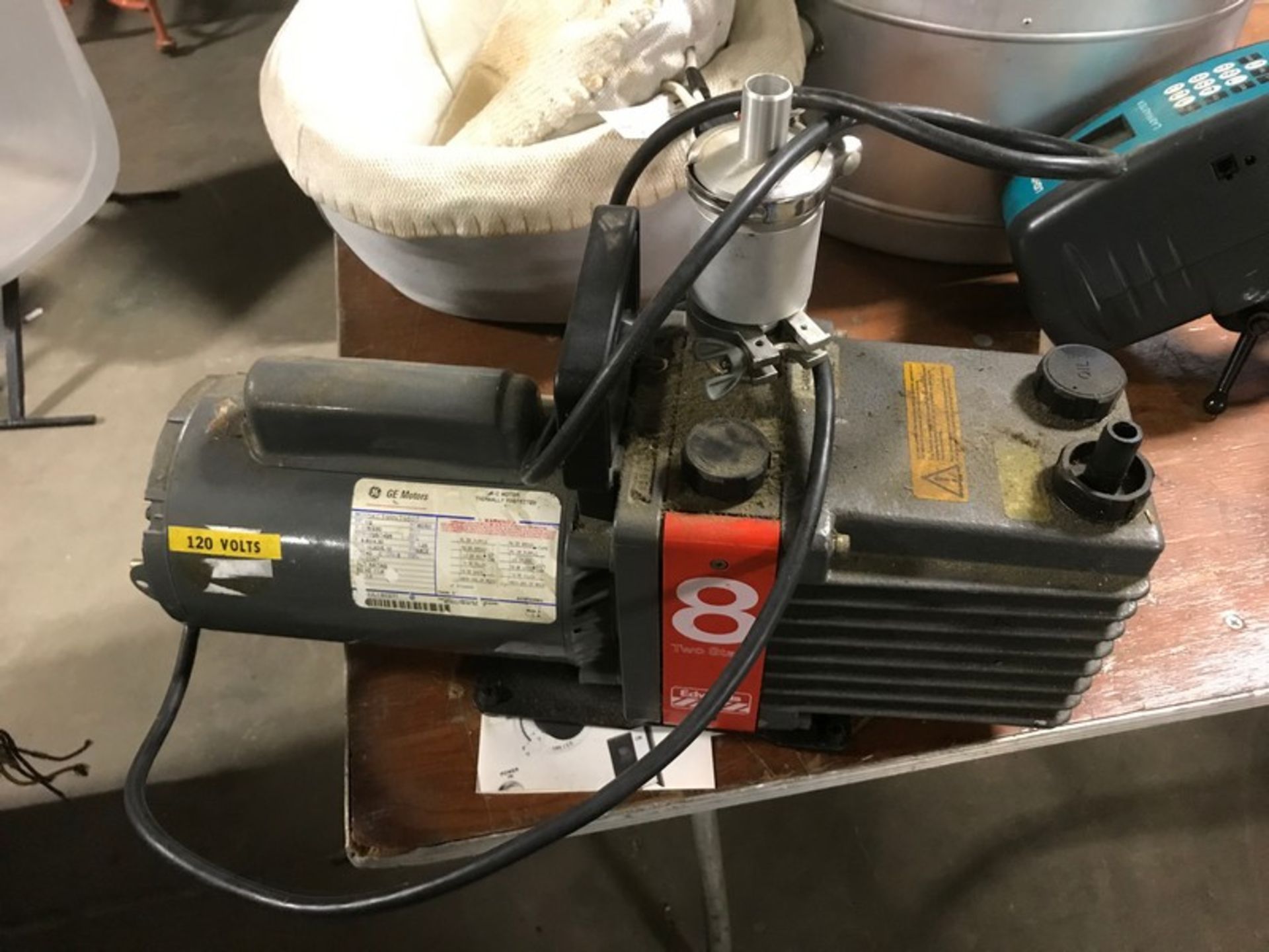 Used Edwards high vacuum pump model E2M8. SN73395  1/2 hp 1 phase 50/60 hz 115/230 v  1725/1425