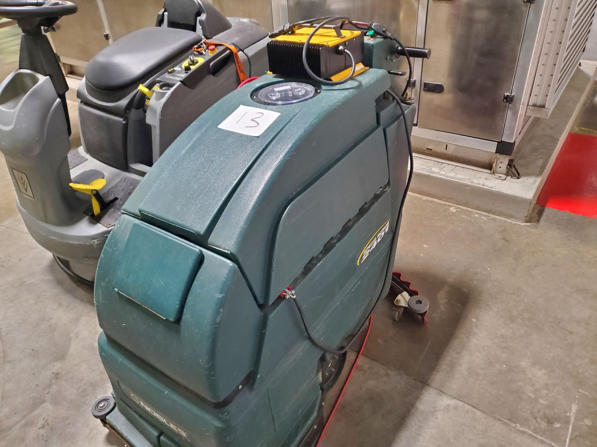 NOBLES Floor Scrubber, Model 2401,  Battery powered. Charger attached to machine NOTE Said to only - Image 2 of 6