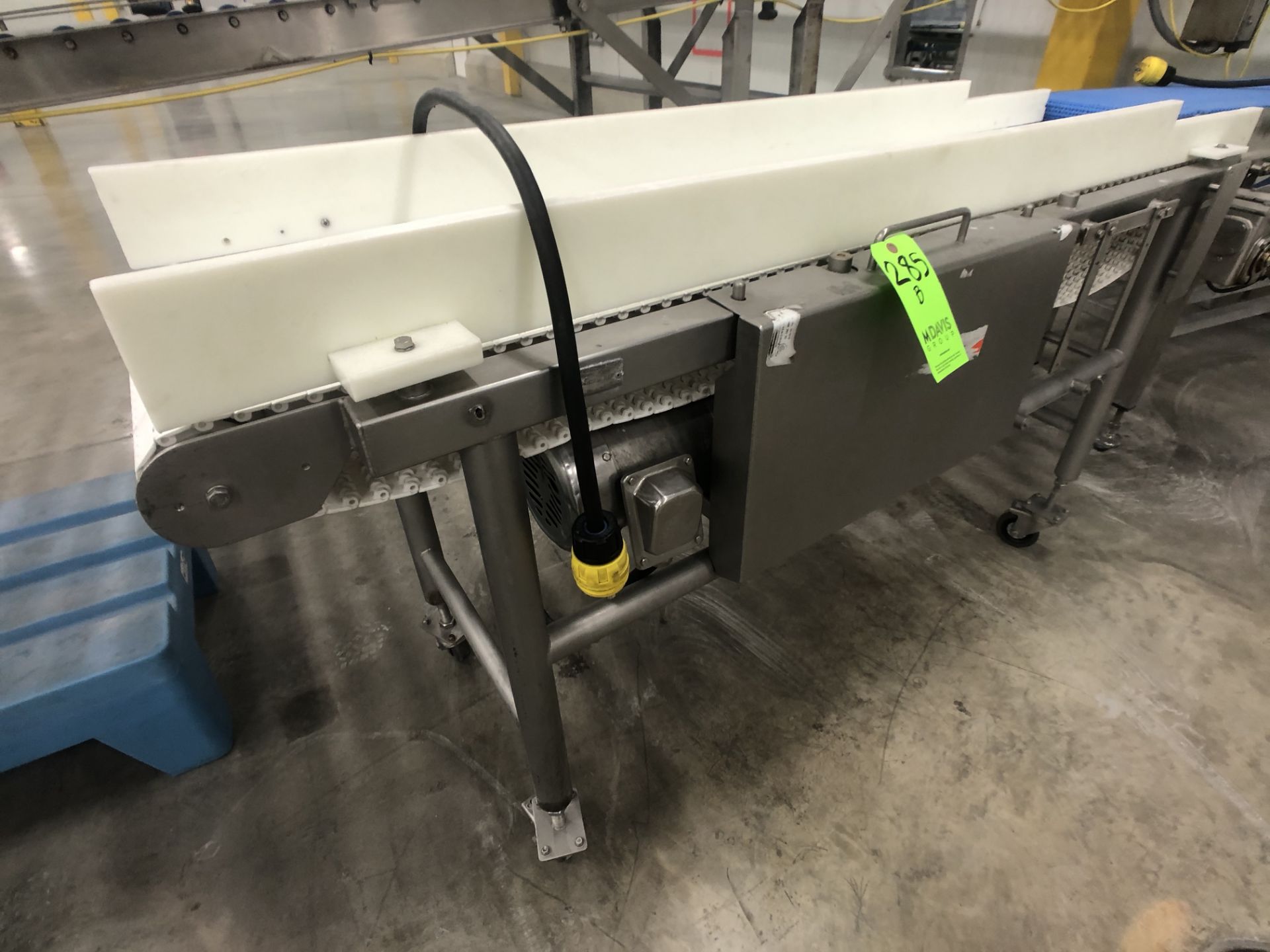 S/S CONVEYOR MOUNTED ON CASTERS W/ S/S MOTOR (NO INFO)