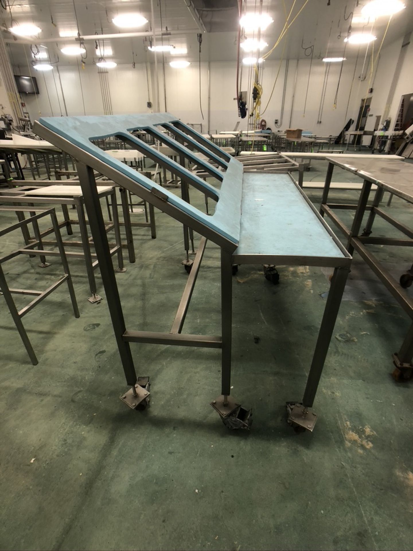 PORTABLE S/S PACKOFF TABLE, MOUNTED ON CASTERS, 64"X34"X55" (APPROX. L W H)