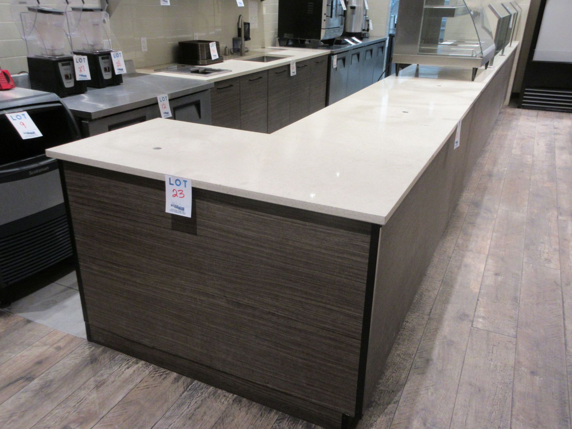 Counter c/w quartz countertop and glass display, 23 ft w x 29"d x 36"h