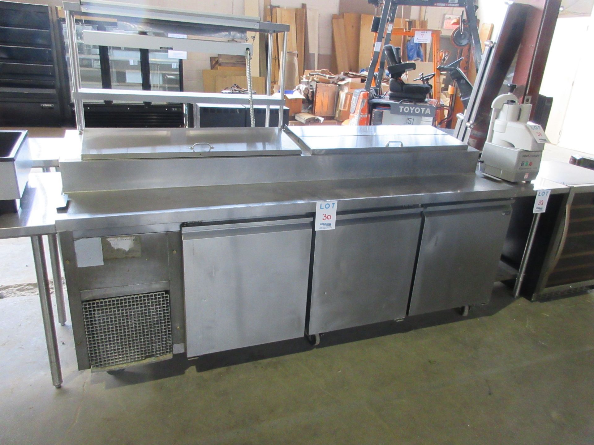 3 Door S/S refrigerated preparation table. Approx. (92”w x 31”d x 42”h)