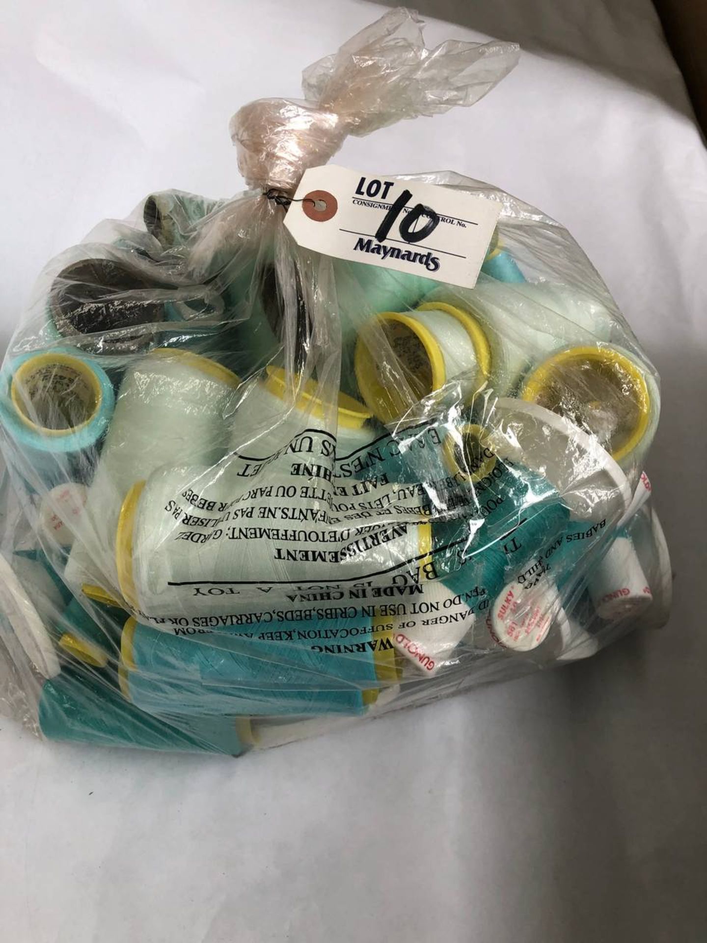 Bag of assorted rolls of mixed colored thread rolls