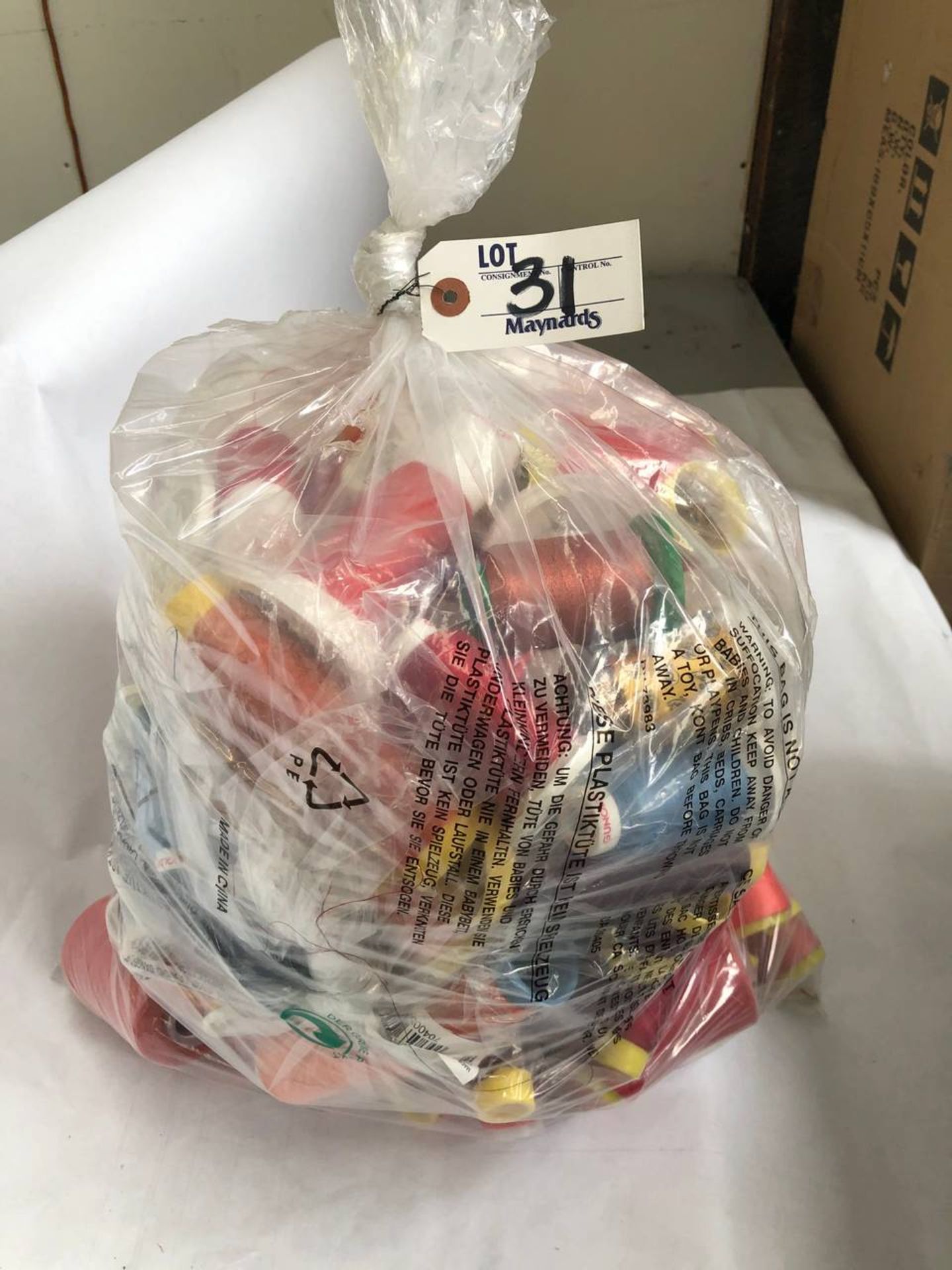 Bag of assorted colored thread rolls