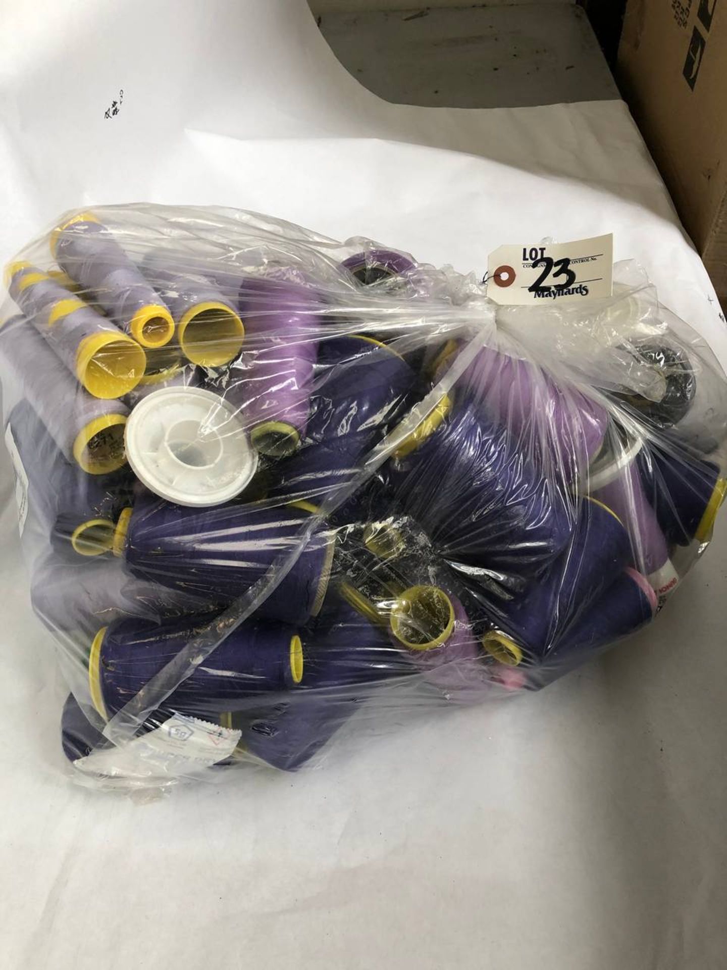 Bag of assorted purple colored thread rolls