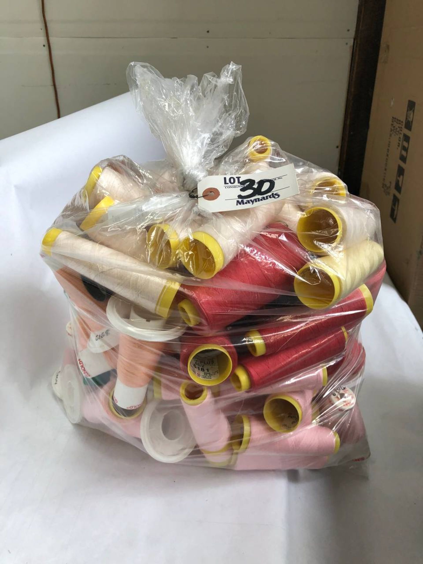 Bag of assorted colored thread rolls