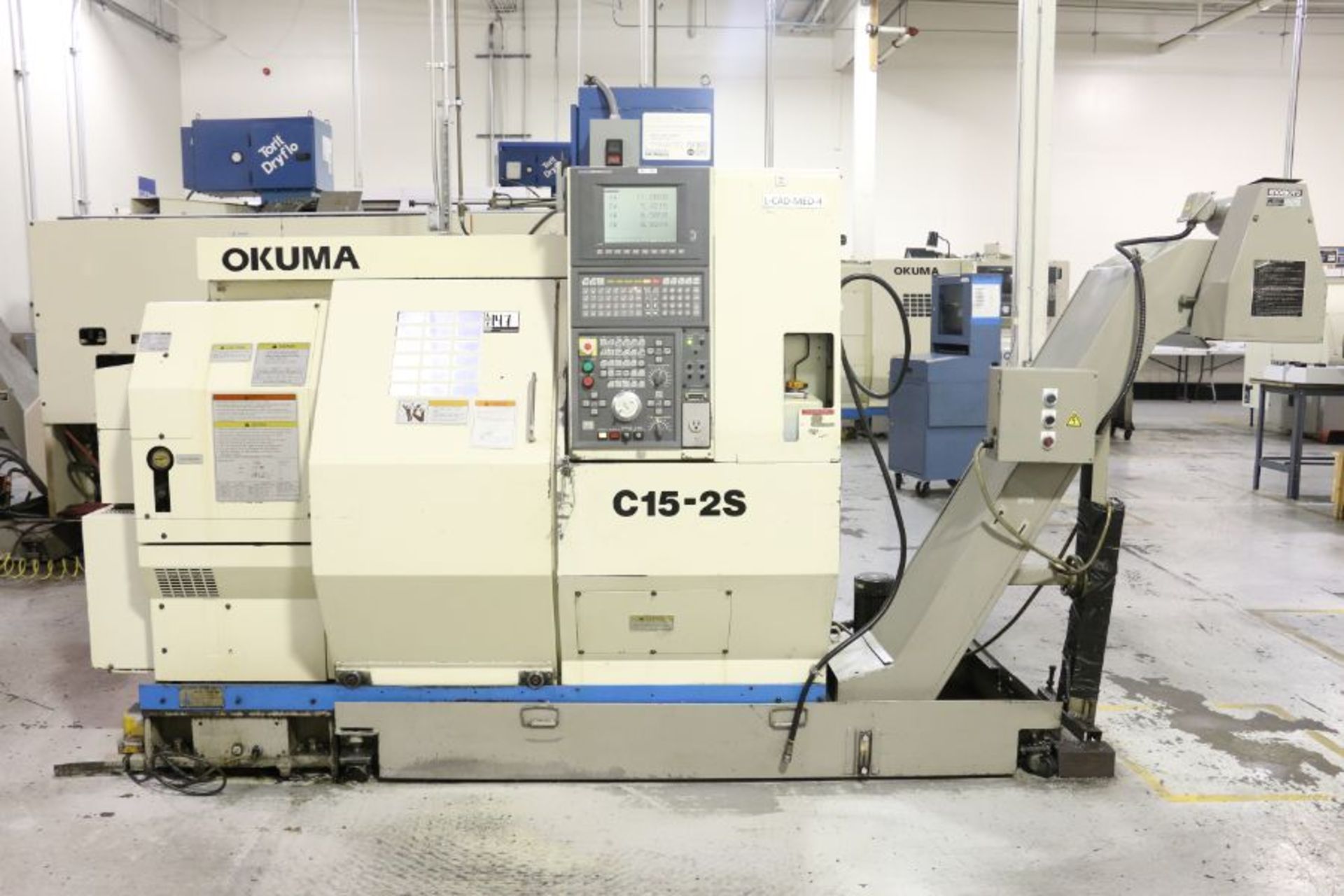 Okuma LCC15-25 4-Axis, OSP-7000L Control, 8 Position Upper & 8 Position Lower Turrets, 8"