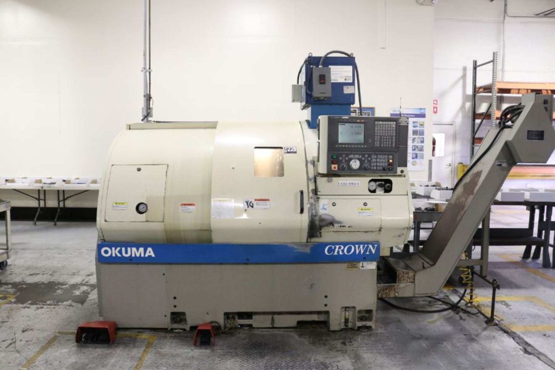 Okuma Crown 762S-SB, OSP-700 control,10.6 turning dia., 19.7" center, 2.4" spindle bore, 12 HP, 4,