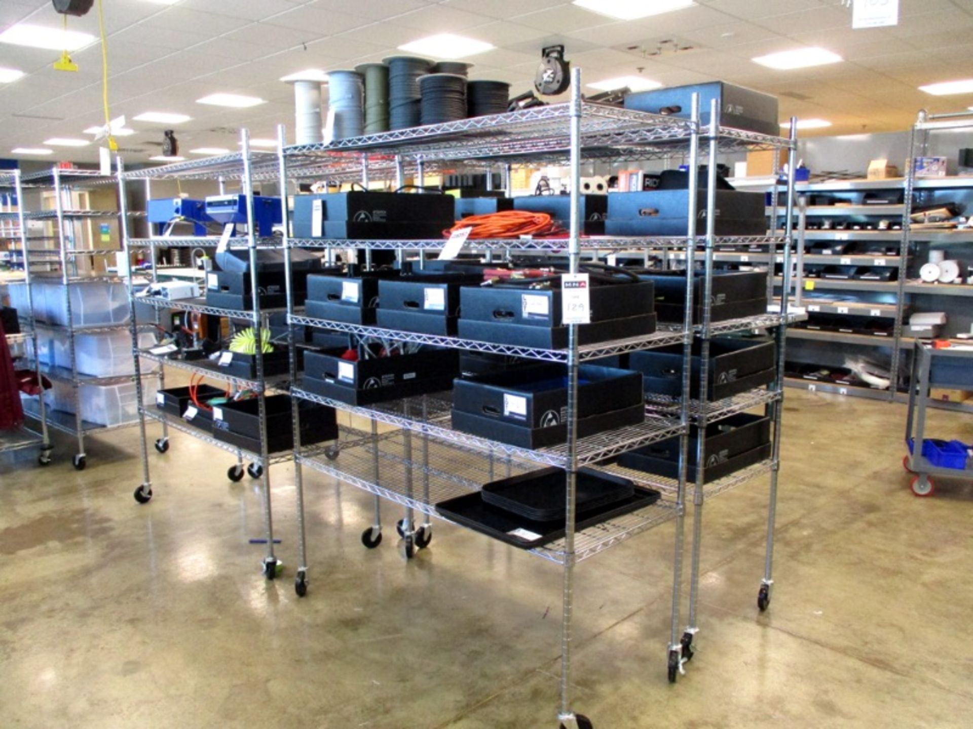 (4) Rolling wire racks, 6' tall (Items on racks not included)