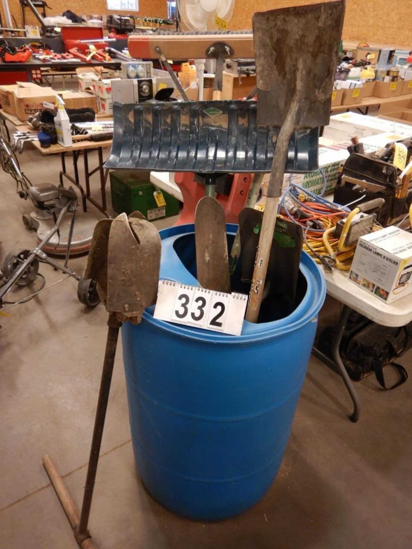 BARREL OF PUSH BROOM, SHOVELS, POST HOLE DIGGER, ETC