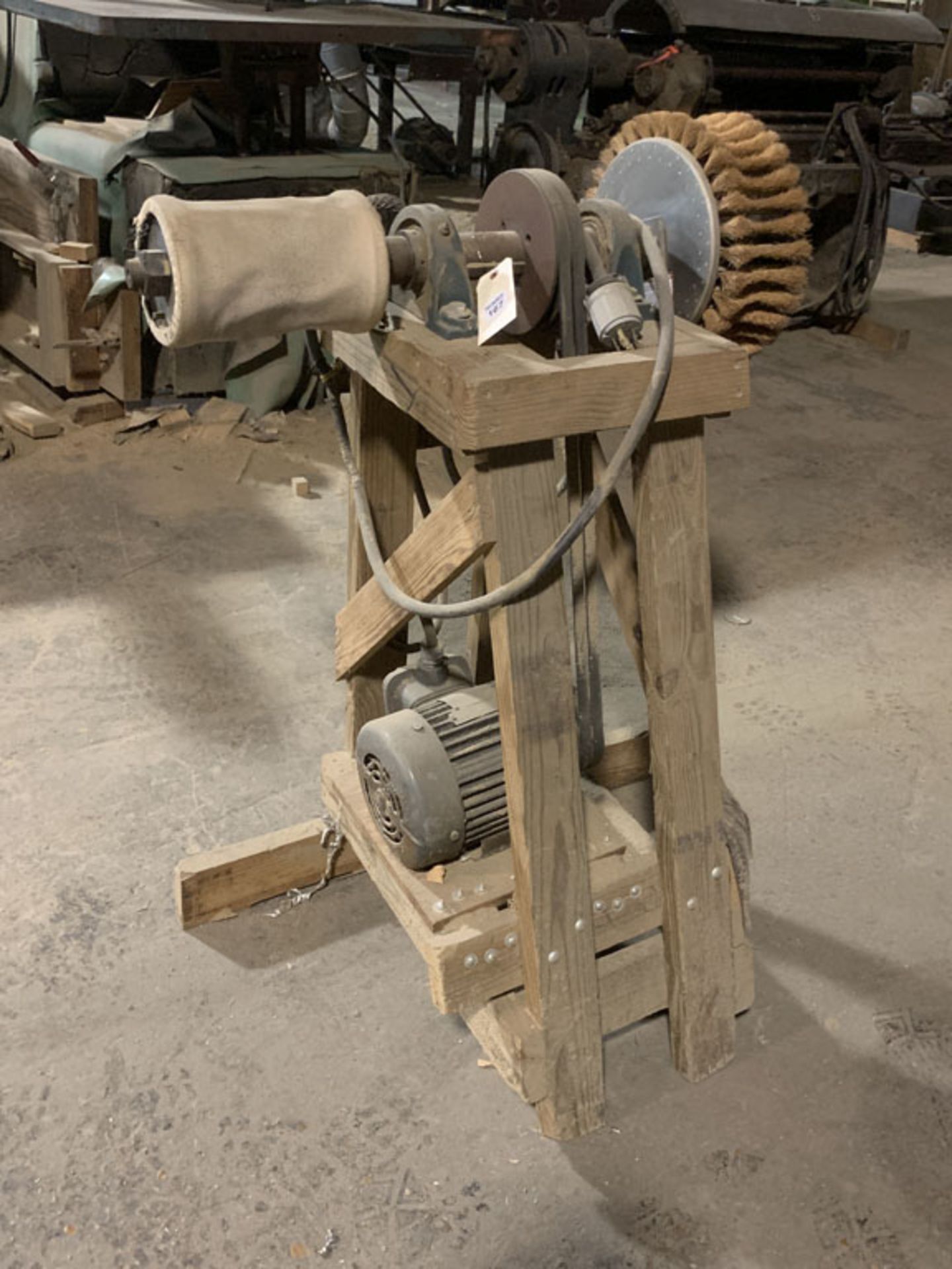 Buffing machine on wooden stand