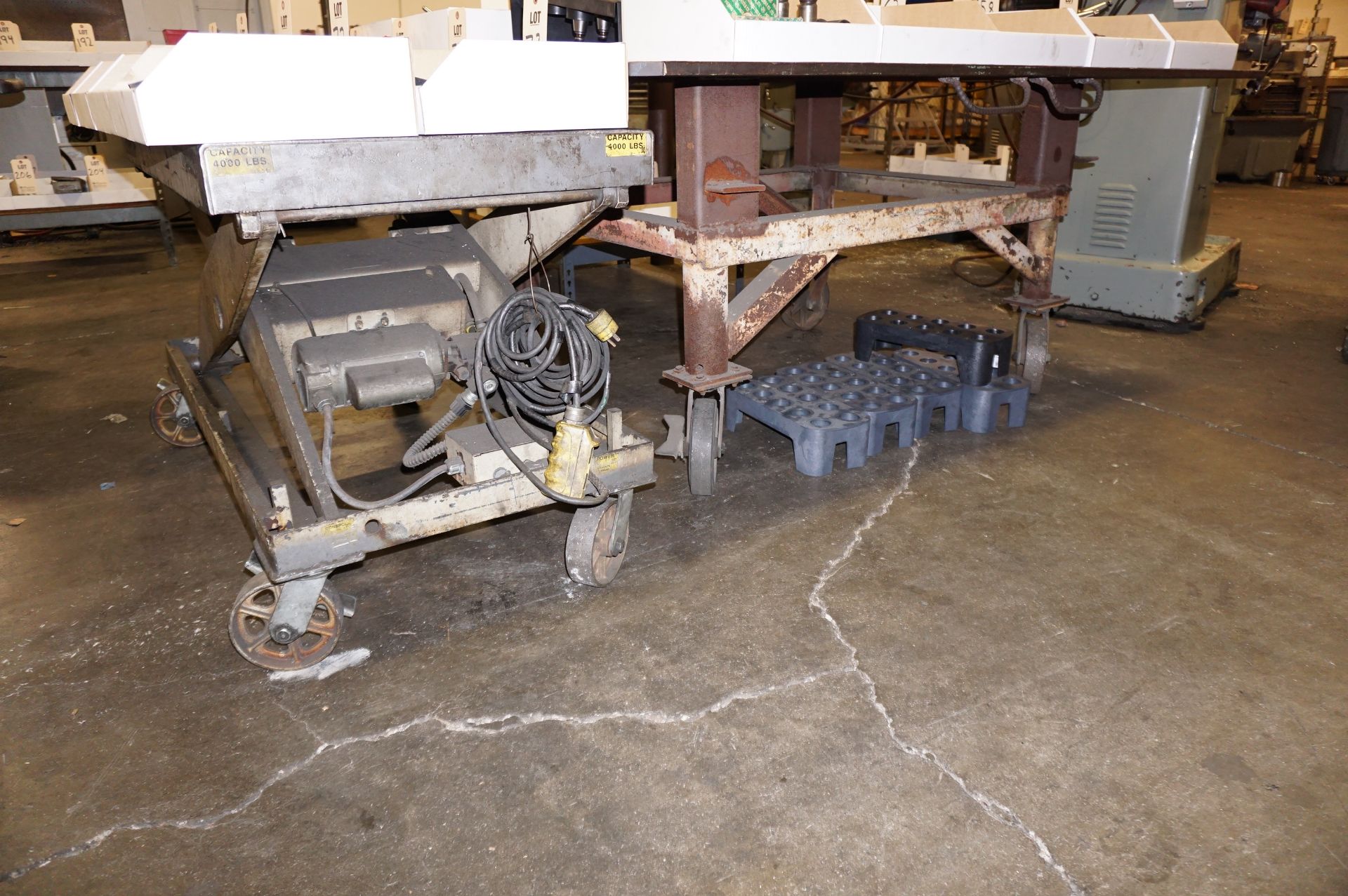 LOT TO INCLUDE: (1) 4000 LB CAP HYDRAULIC LIFT MODEL L9436, S/N 50250A, (1) STEEL WORK TABLE,