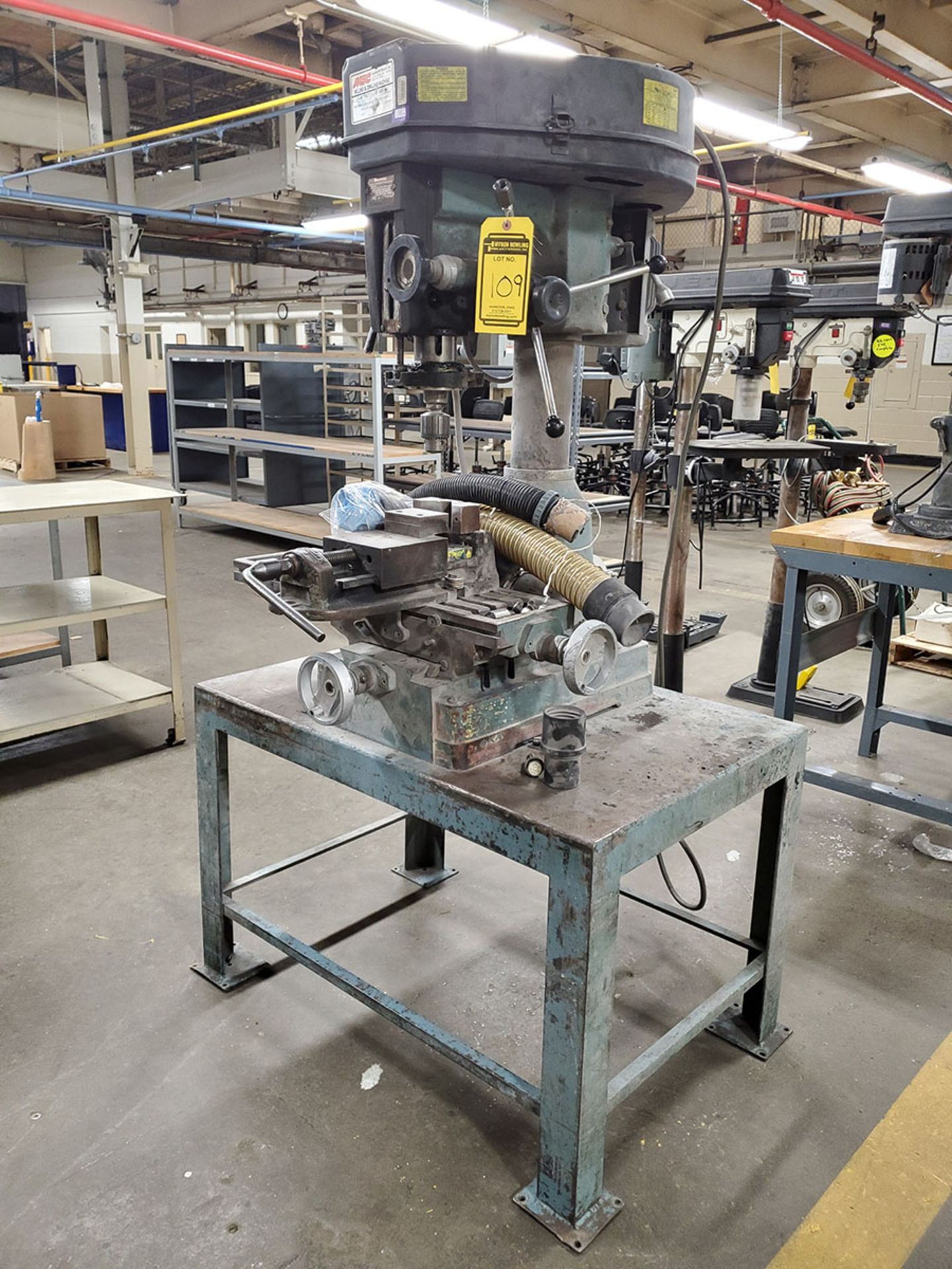 MSC MILLING AND DRILLING MACHINE; MODEL 954201, S/N 9991, MOUNTED ON TABLE WITH BRIDGEPORT VISE