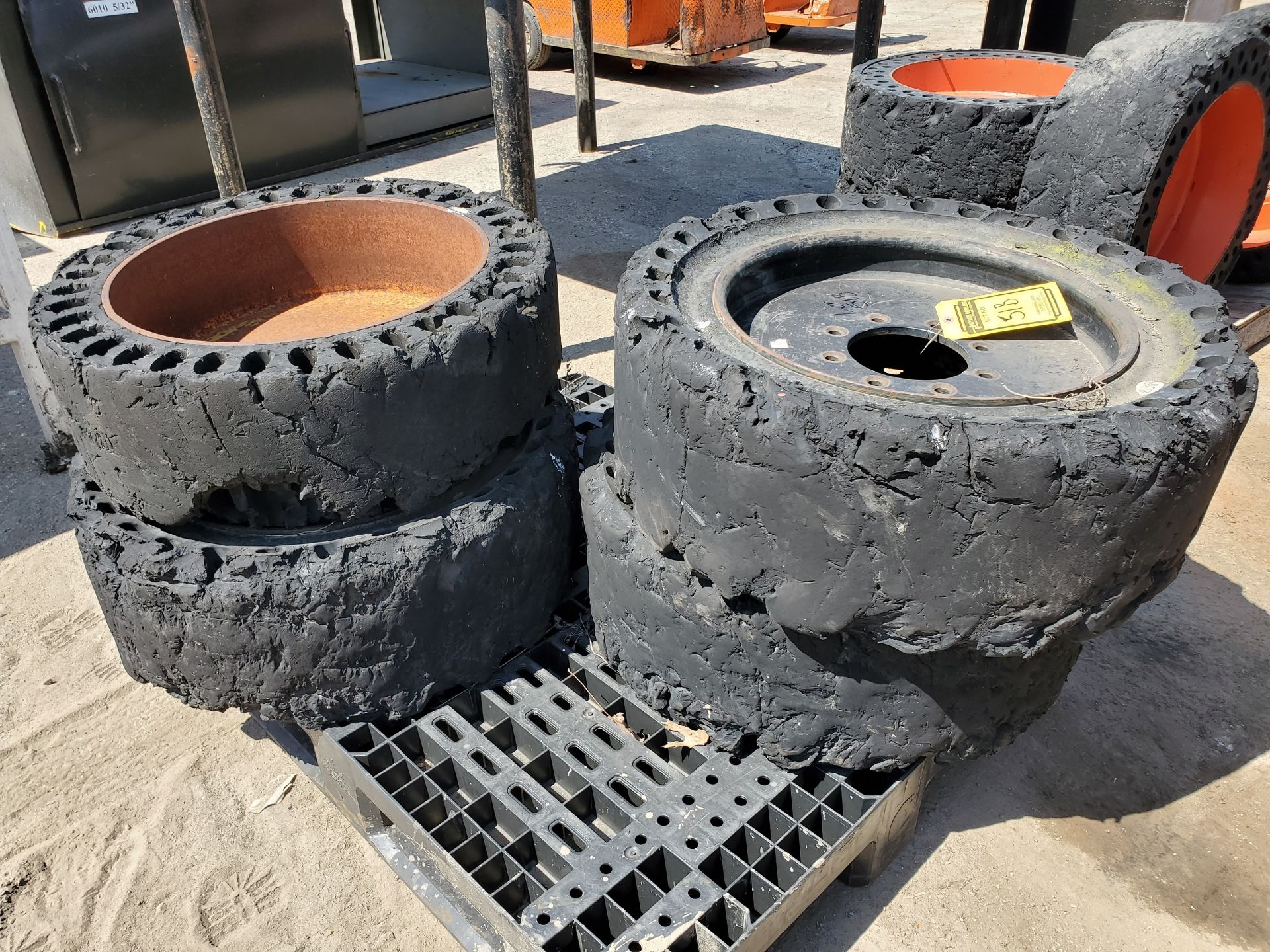 (4) SOLID SKID STEER WHEELS