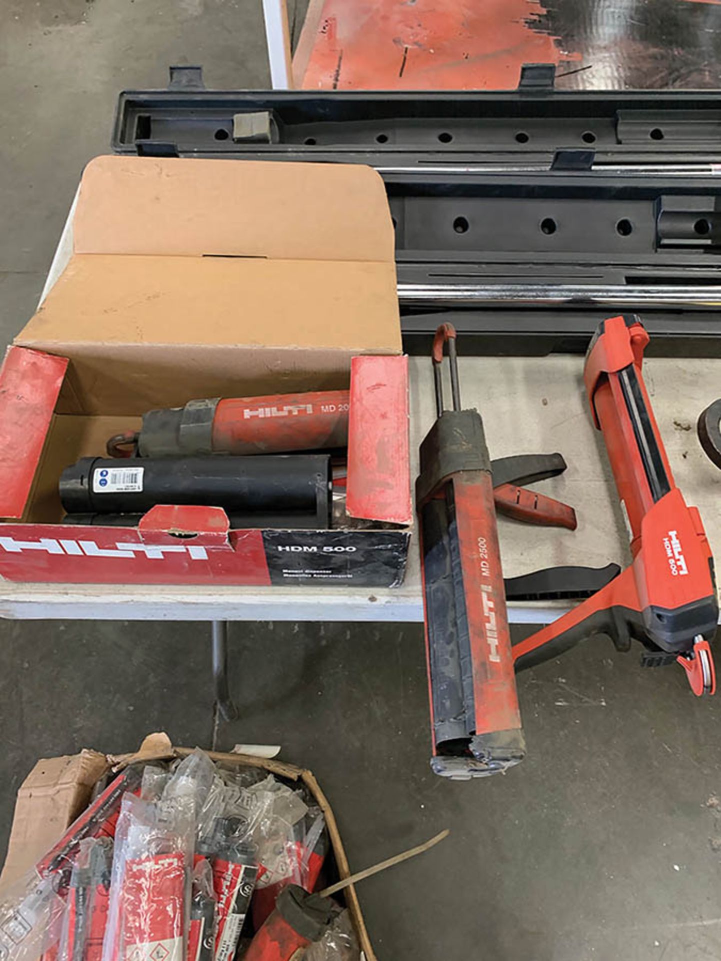 (3) HILTI CAULKING GUNS WITH BOX OF CAULKING