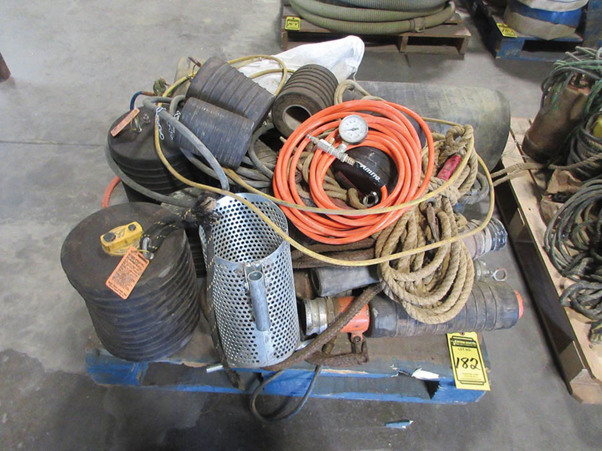 (2) PALLETS W/ ASSORTED BALL PLUGS, MANUAL AIR PUMPS, AND AIR LINE