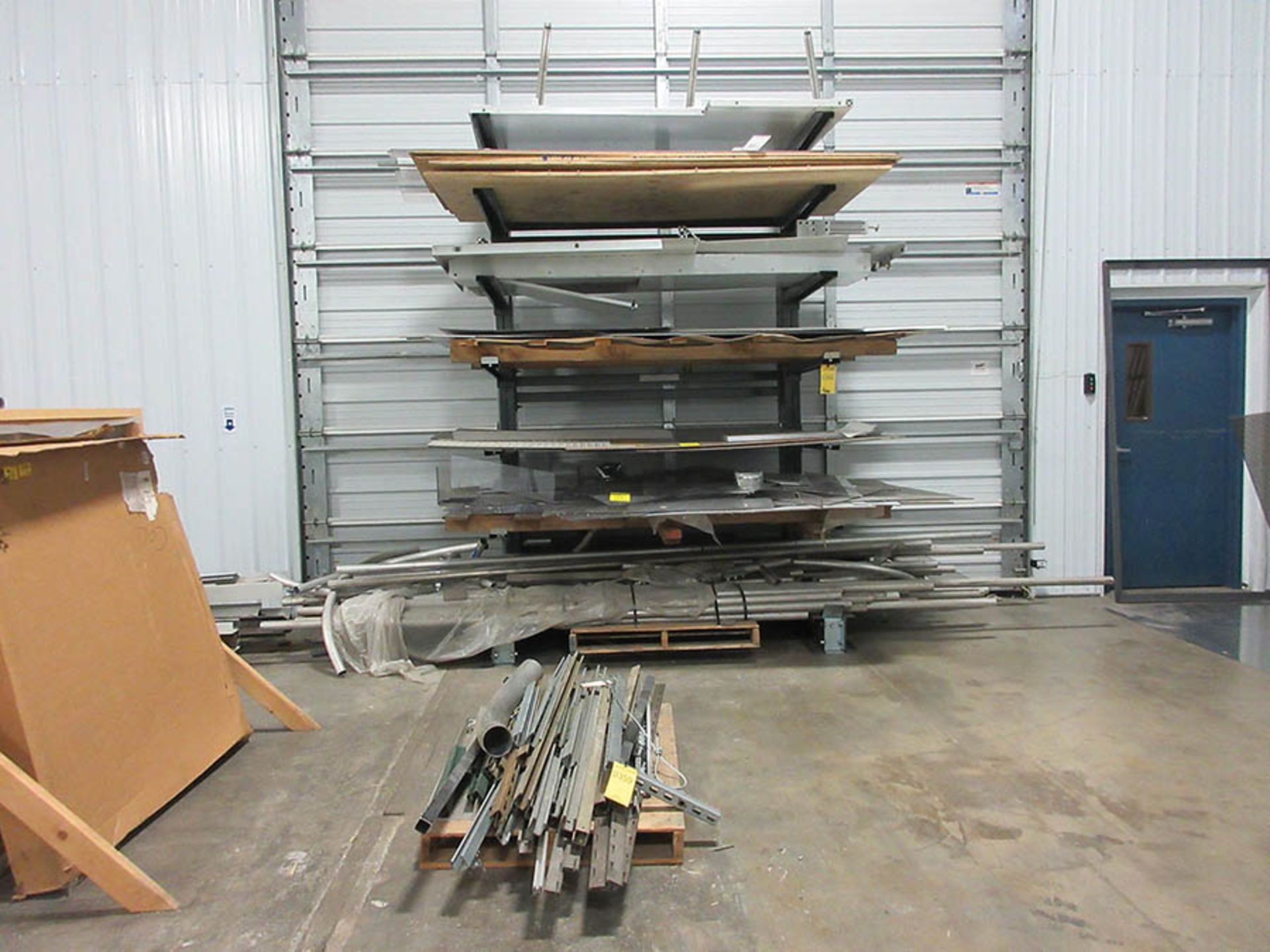 CONTENTS OF CANTILEVER RACK - CONDUIT, DIAMOND PLATE, LEXAN, AND PLYWOOD