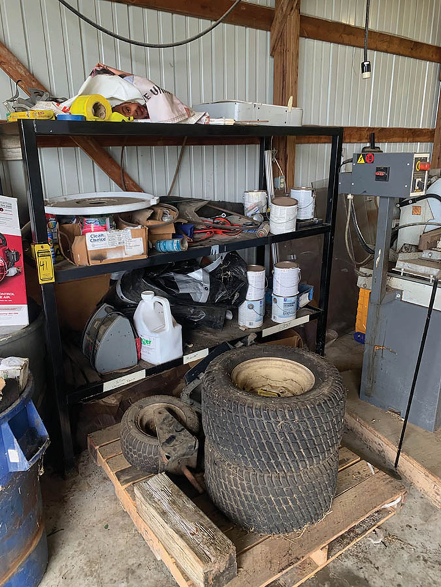 ASSORTED MISC. PARTS ON SHELF AND PALLET, INCLUDING TIRES AND JUMPER PACK