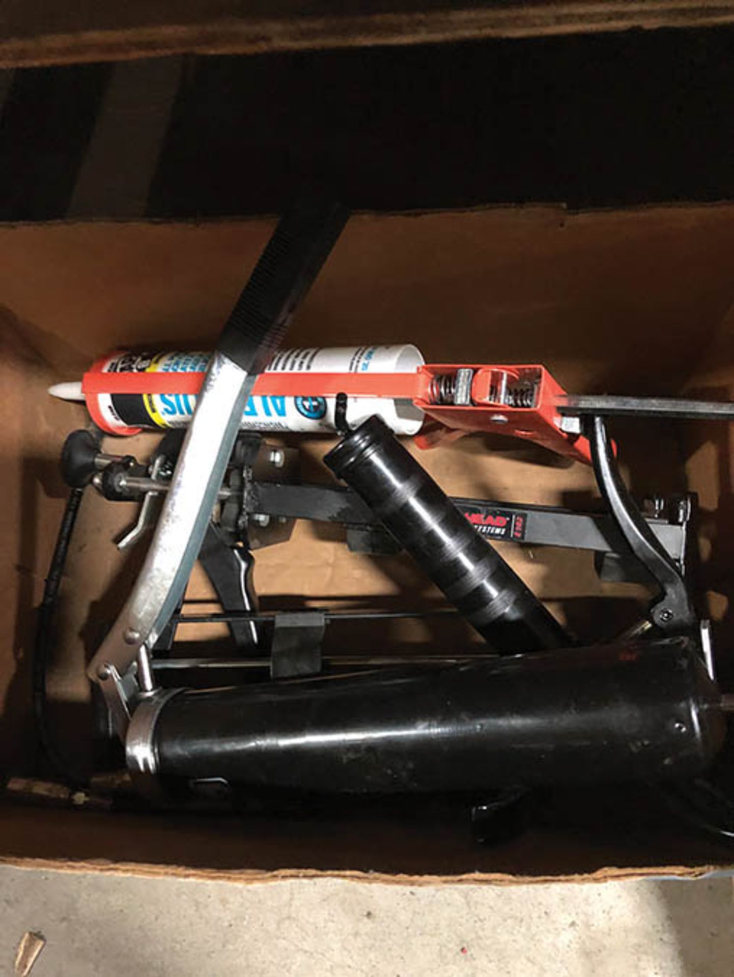 BOX OF CAULKING, GREASE GUNS AND CAULKING