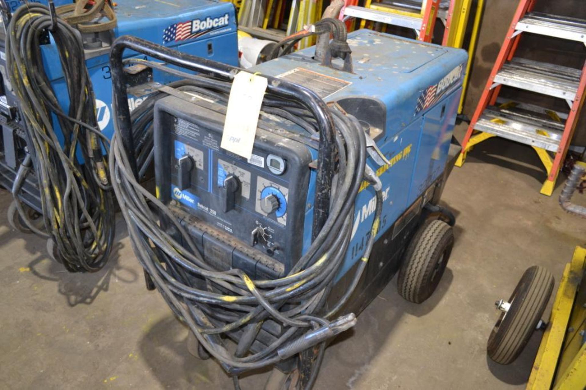 MILLER 250 AMP PORTABLE LP WELDER/GENERATOR MODEL BOBCAT 250; WITH CABLES & CLAMPS (BUILDING #1)