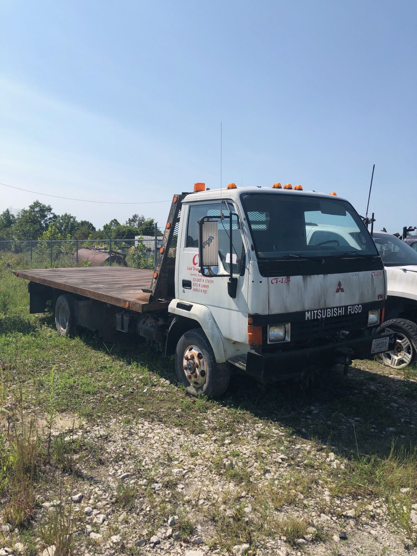 MITSUBISHI FUSO ROLLBACK TRUCK, 94'' X 216'' BED, CT 124, LOCATION: MARCO SHOP