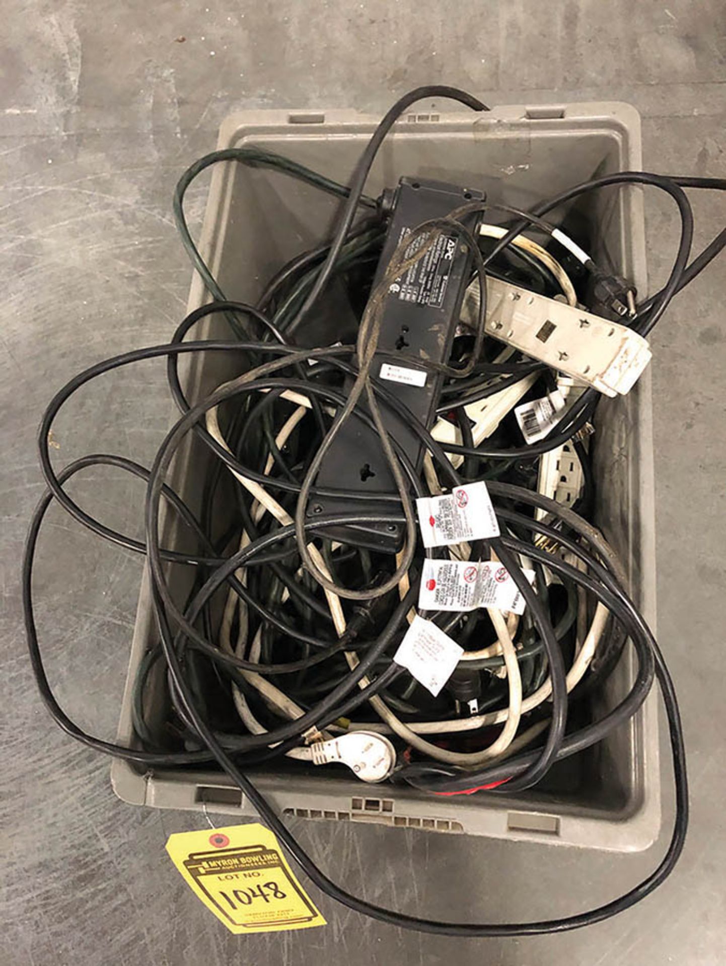 BIN OF EXTENSION CORDS AND POWER STRIPS