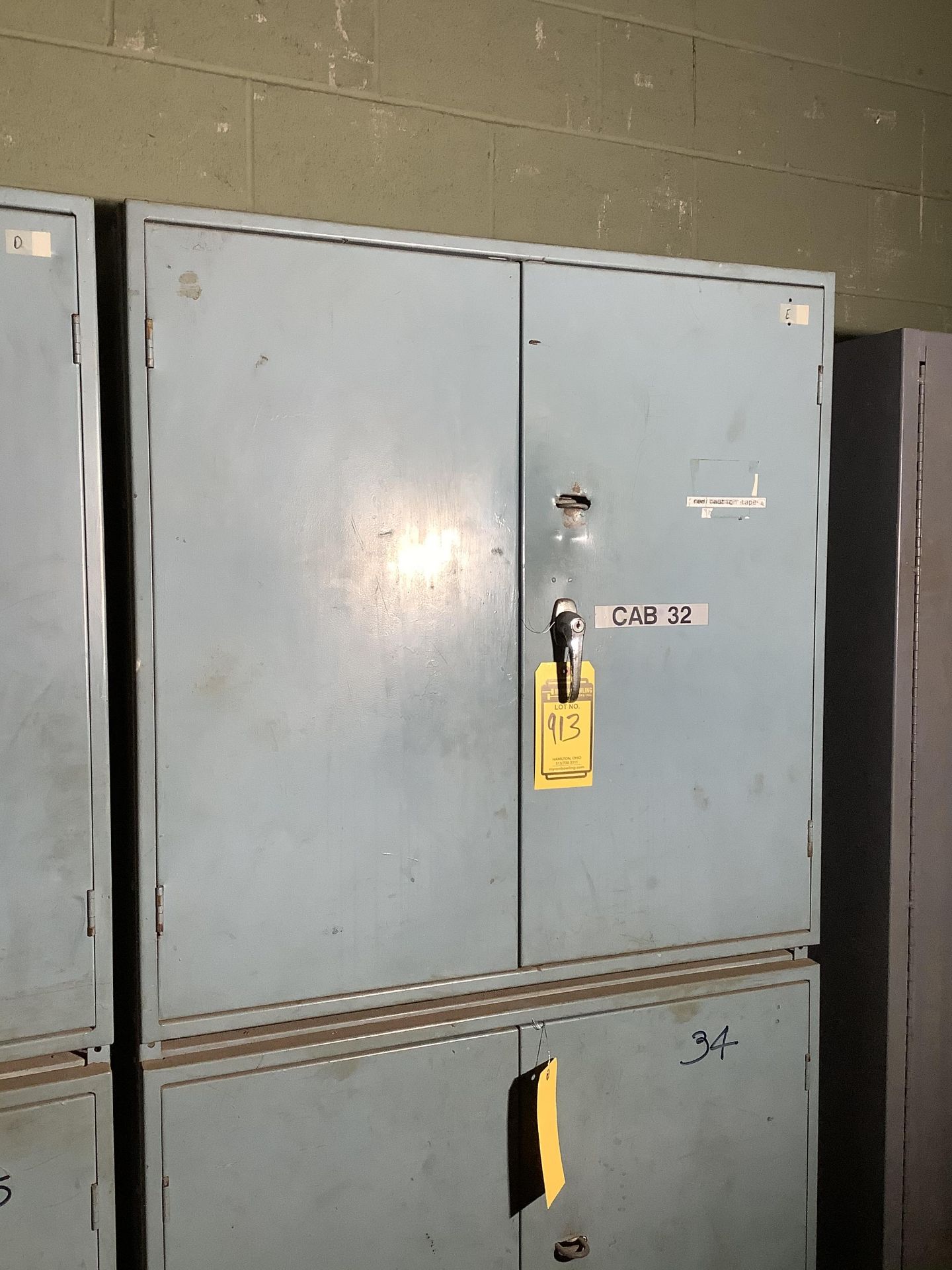 SMALL 2 DOOR FRONT FACING CABINET WITH GLOVES AND LOCKOUT/TAG OUT LOCKS