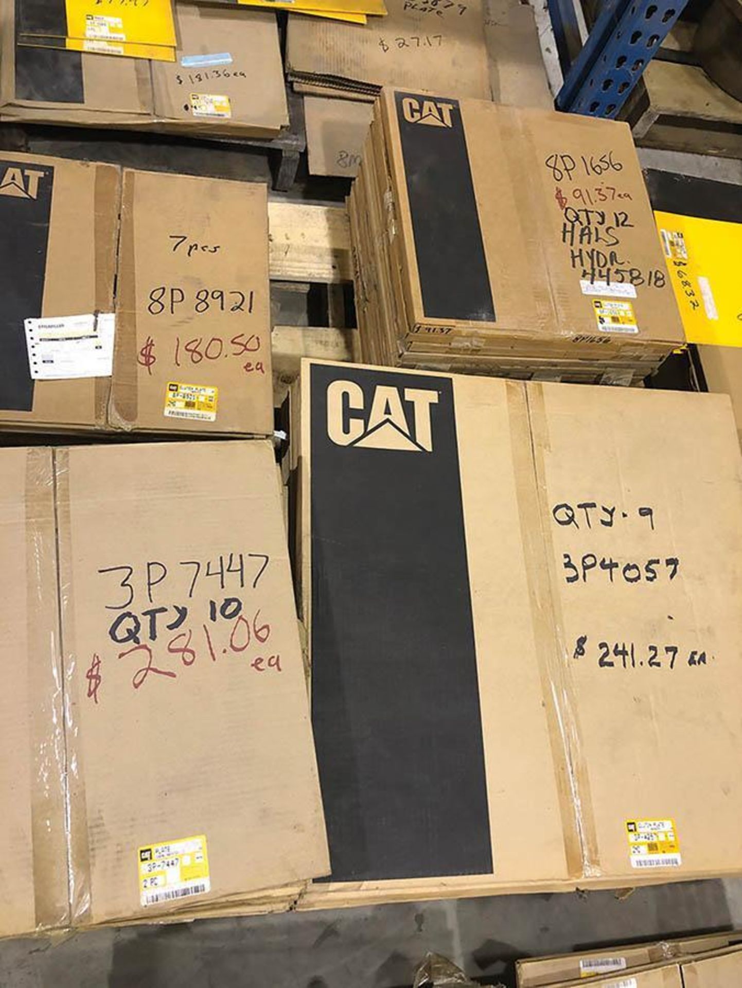 SKID OF NEW CATERPILLAR PLATES AND DISC