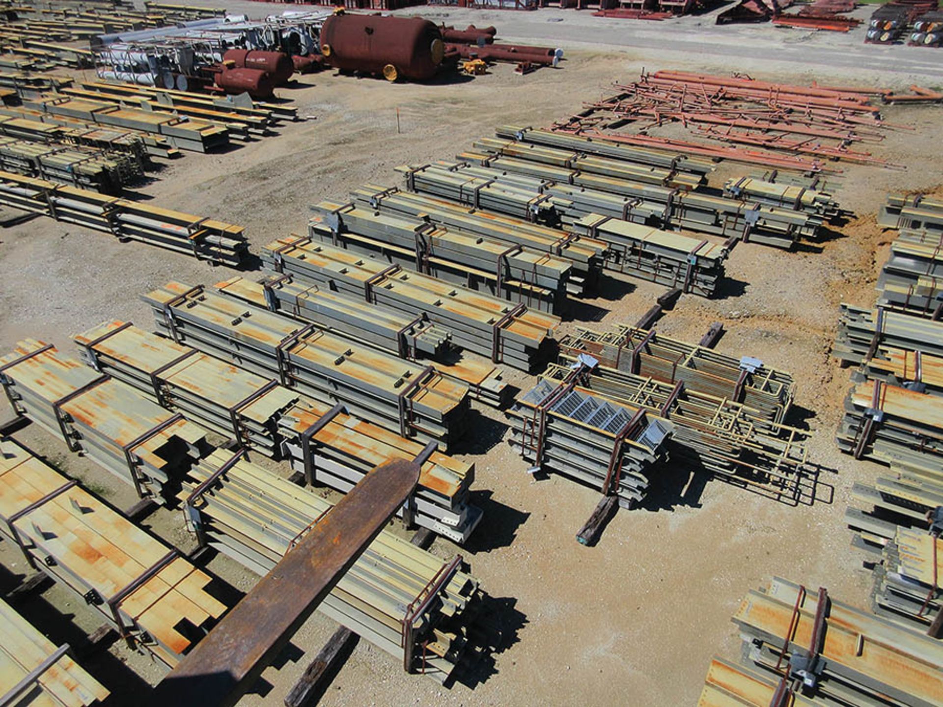 LARGE LOT OF STRUCTURAL STEEL: CONSISTS MOSTLY OF 1'' THICK OR LESS STEEL BEAMS, VARIOUS LENGTHS,