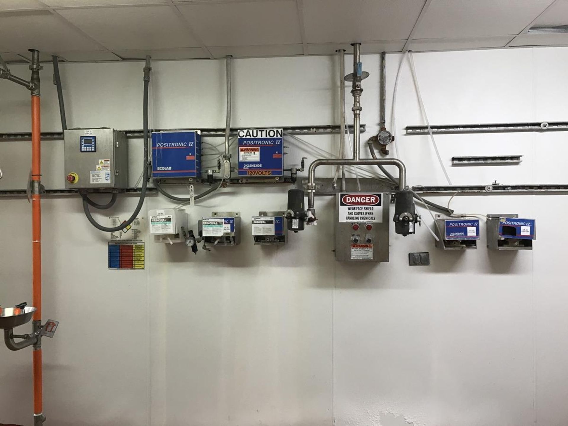 Ecolab Pumps, Controllers, Water Filters on wall in CIP Room | Rig Fee: $150