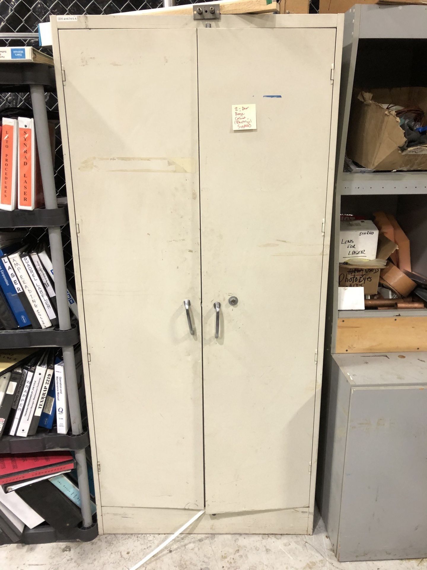 2-Door Metal Cabinet With Contents | Rig Fee: $25 or Buyer Remove