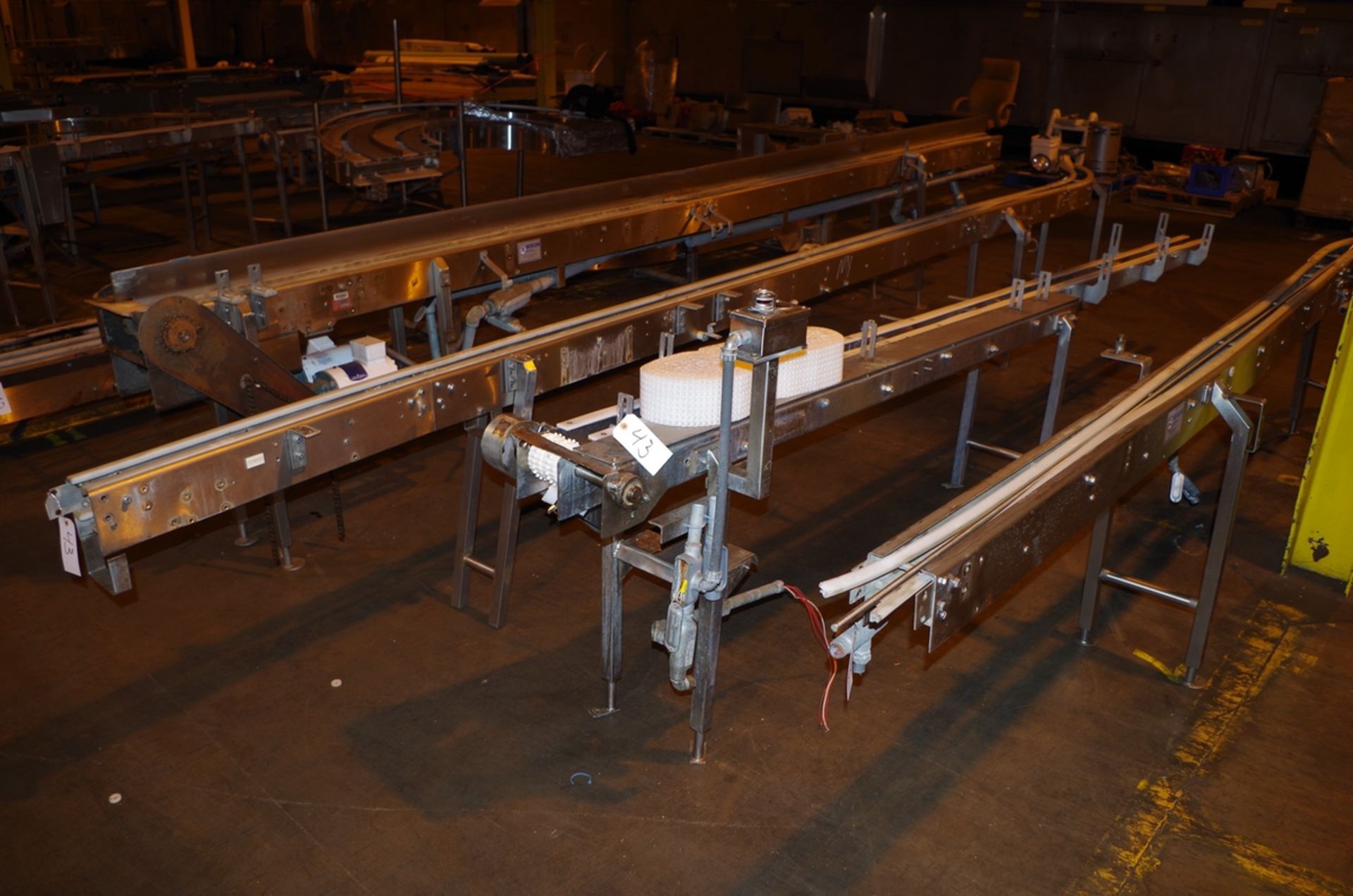 (4) Stainless Steel Conveyor Frame Units, 1 with drive motors, 2 with 45 degree tur | Rig Fee: $200