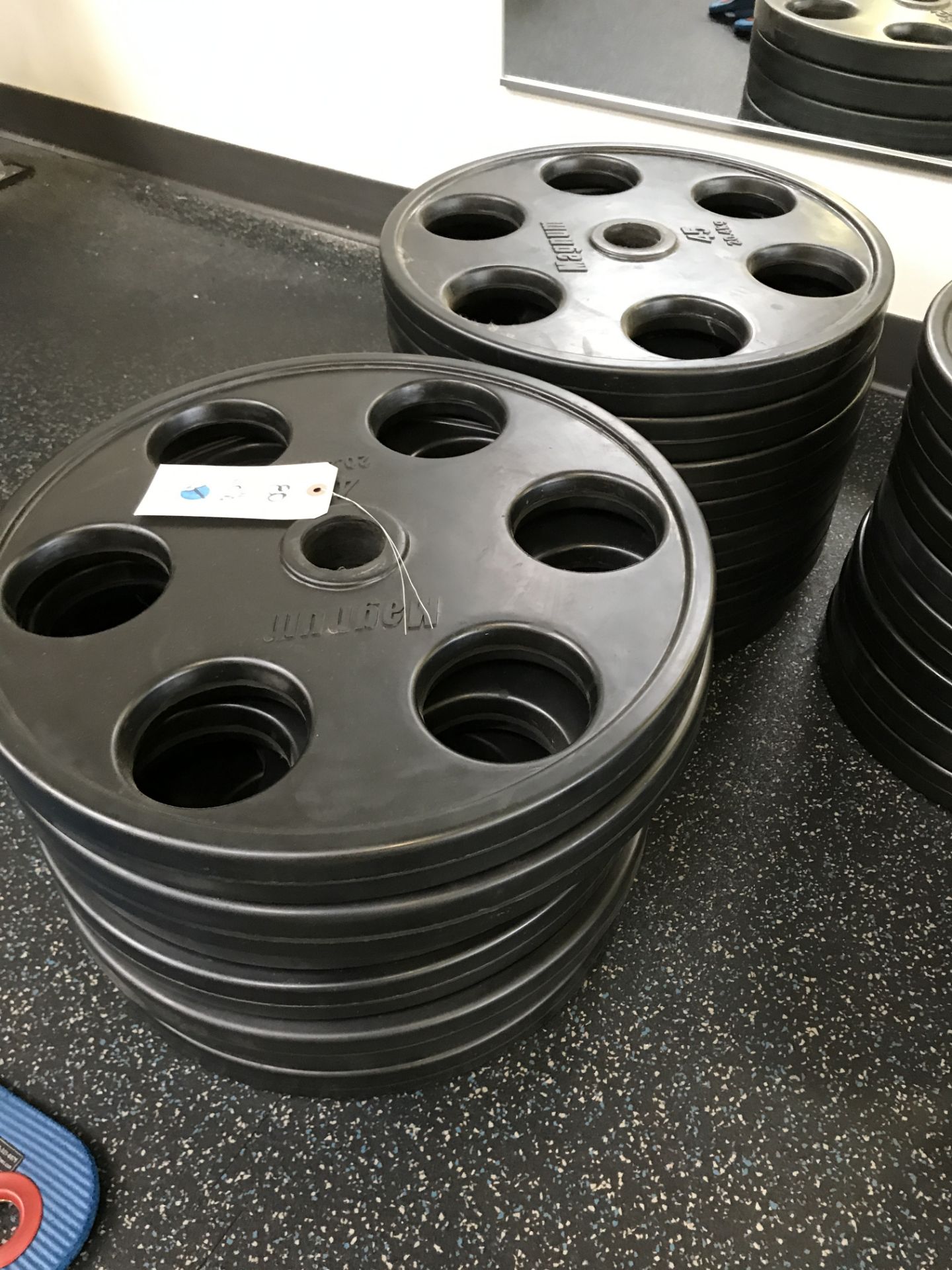 {LOT} (16) 45Lbs Magnum Rubber Encased Olympic Plate Weights