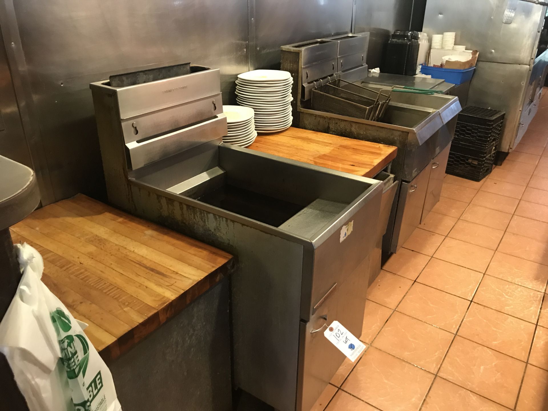 {LOT} (3) Asst. Gas Fryers, 5 Pan Steam Table, (2) Upright Broilers, Refrigerator Base Station, (