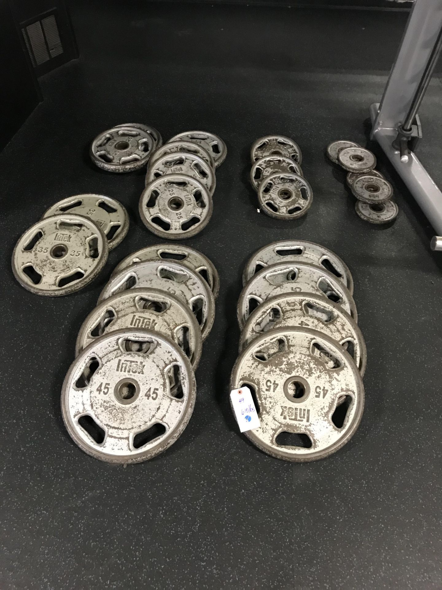 Intek Weight Plates - 610 Lbs. Total c/o: (8) 45 Lb., (1) 35 Lb., (6) 25 Lb., (4) 10 Lb., (5) 5 Lb.