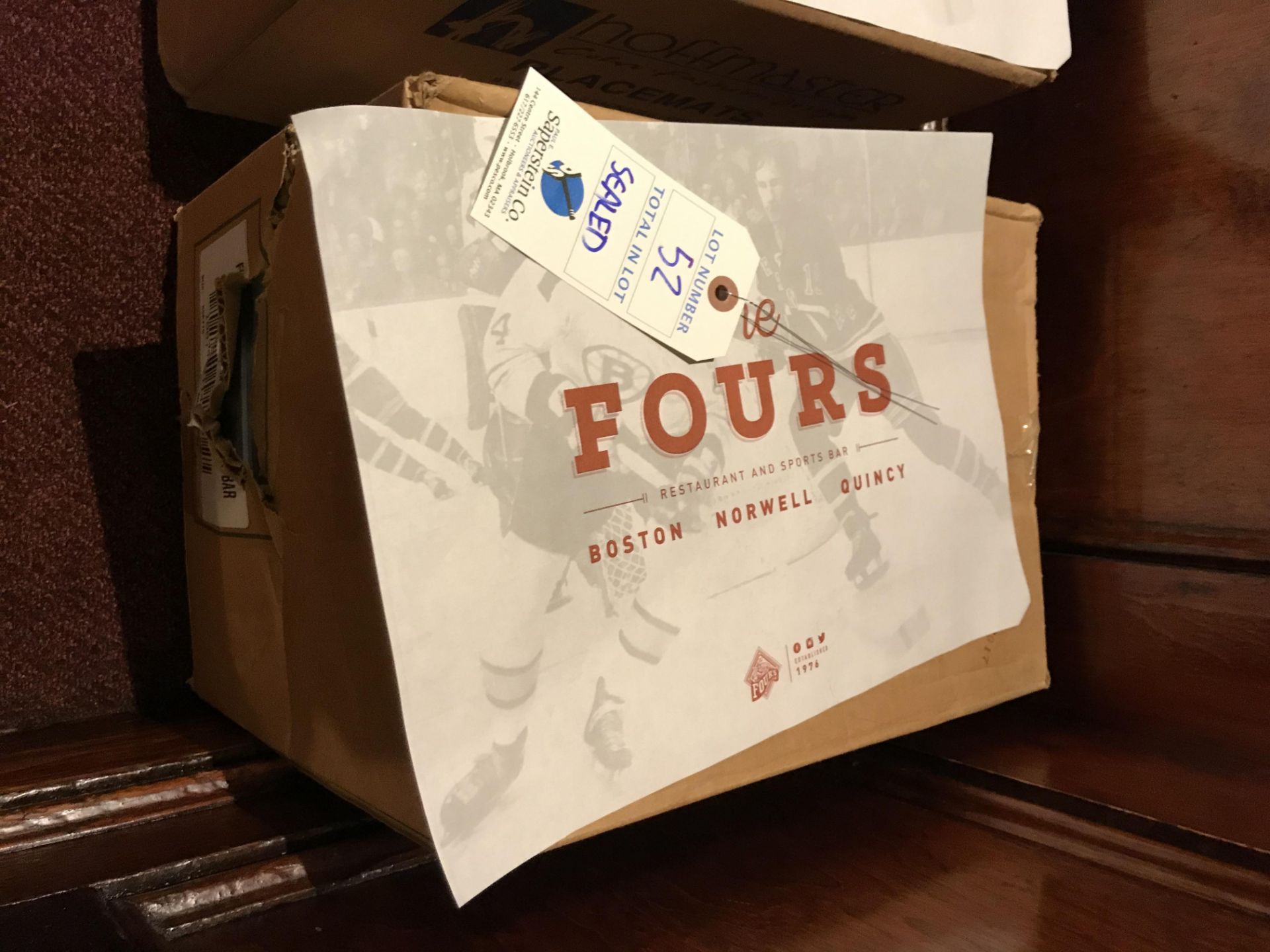 Sealed case of The Fours Paper Placemats