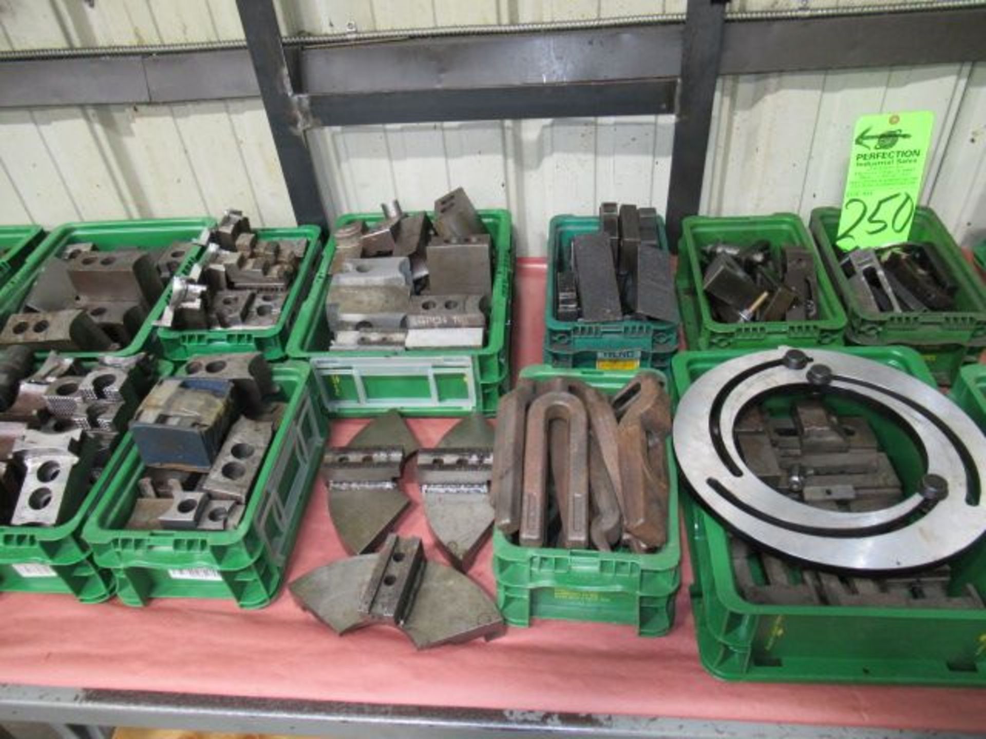 Lot. Assorted Types Of Machine Hold Down's On Table Top Approx. 12 Boxes ($150 Rigging Cost)