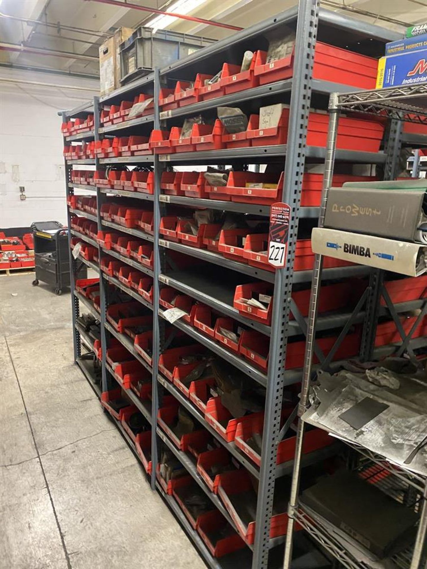 Row of Shelving Including Shaft Seals, Pulleys, Springs, Couplings, and Wheels