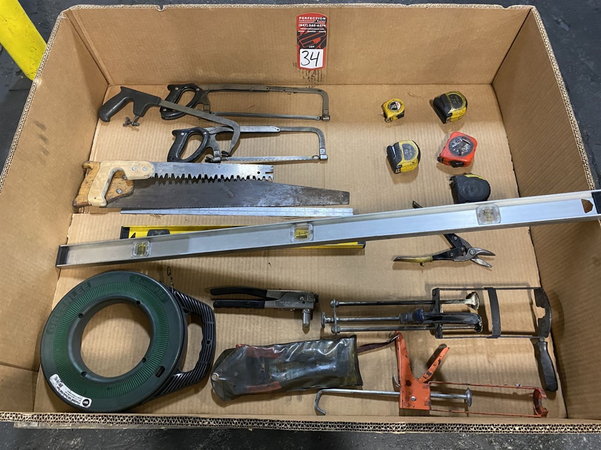 Lot of Assorted Tools Including Hand Riveters, Levels, Fish Tape, Saws, and Tape Measures