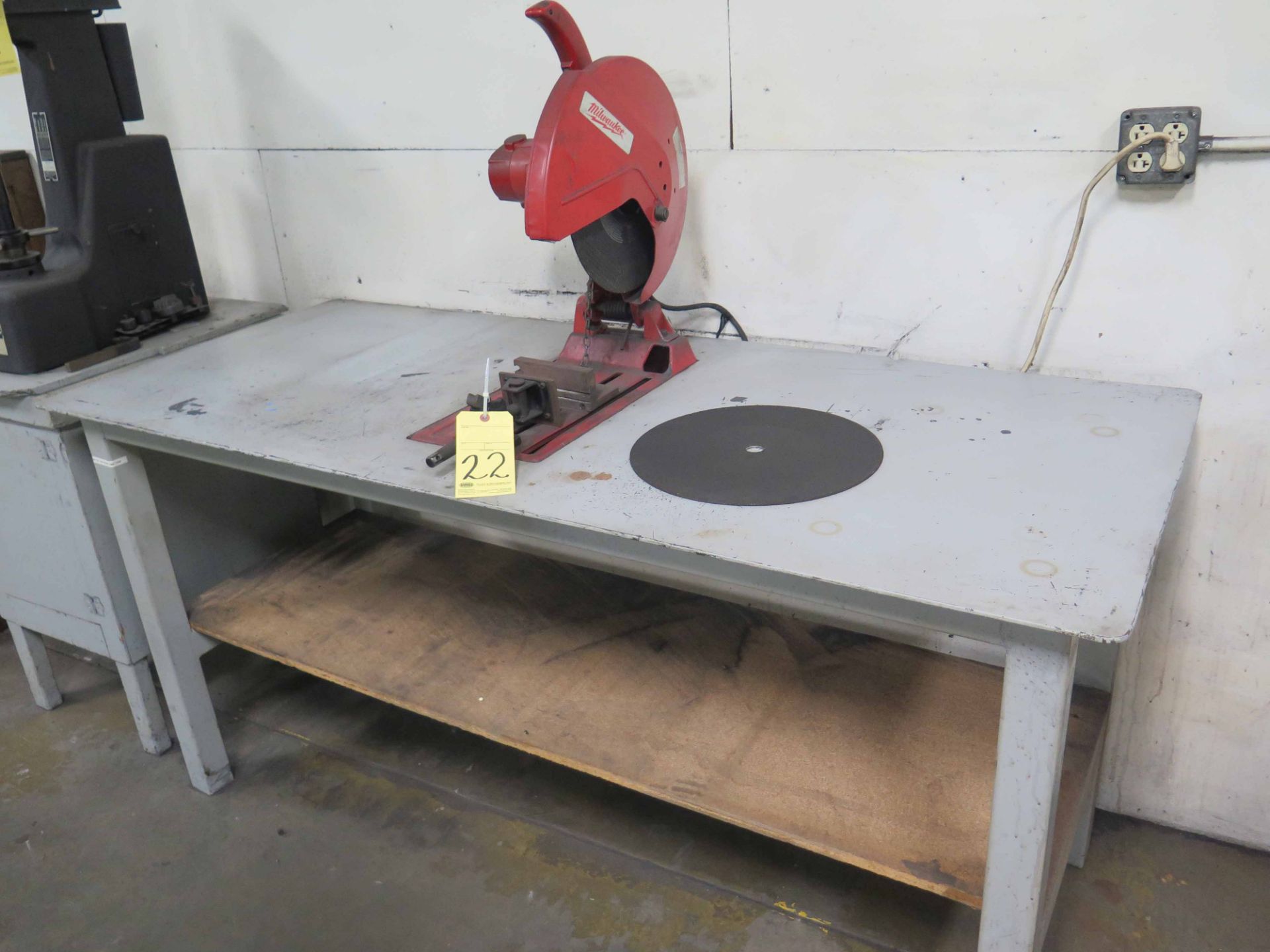 CHOP SAW, MILWAUKEE, set up on H.D. metal table