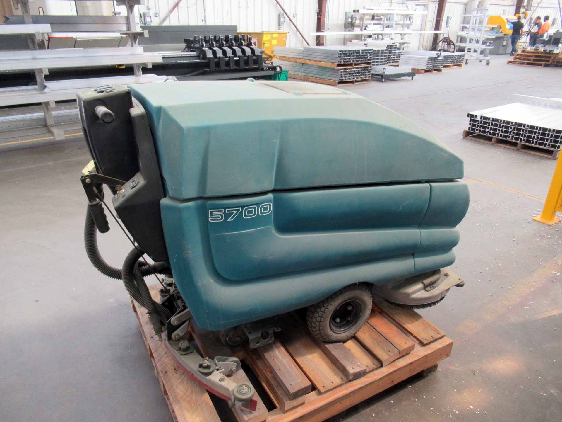 FLOOR SWEEPER, TENNANT MDL. 5700 WALK BEHIND TYPE, battery operated, battery charger (Location 1: - Image 3 of 5